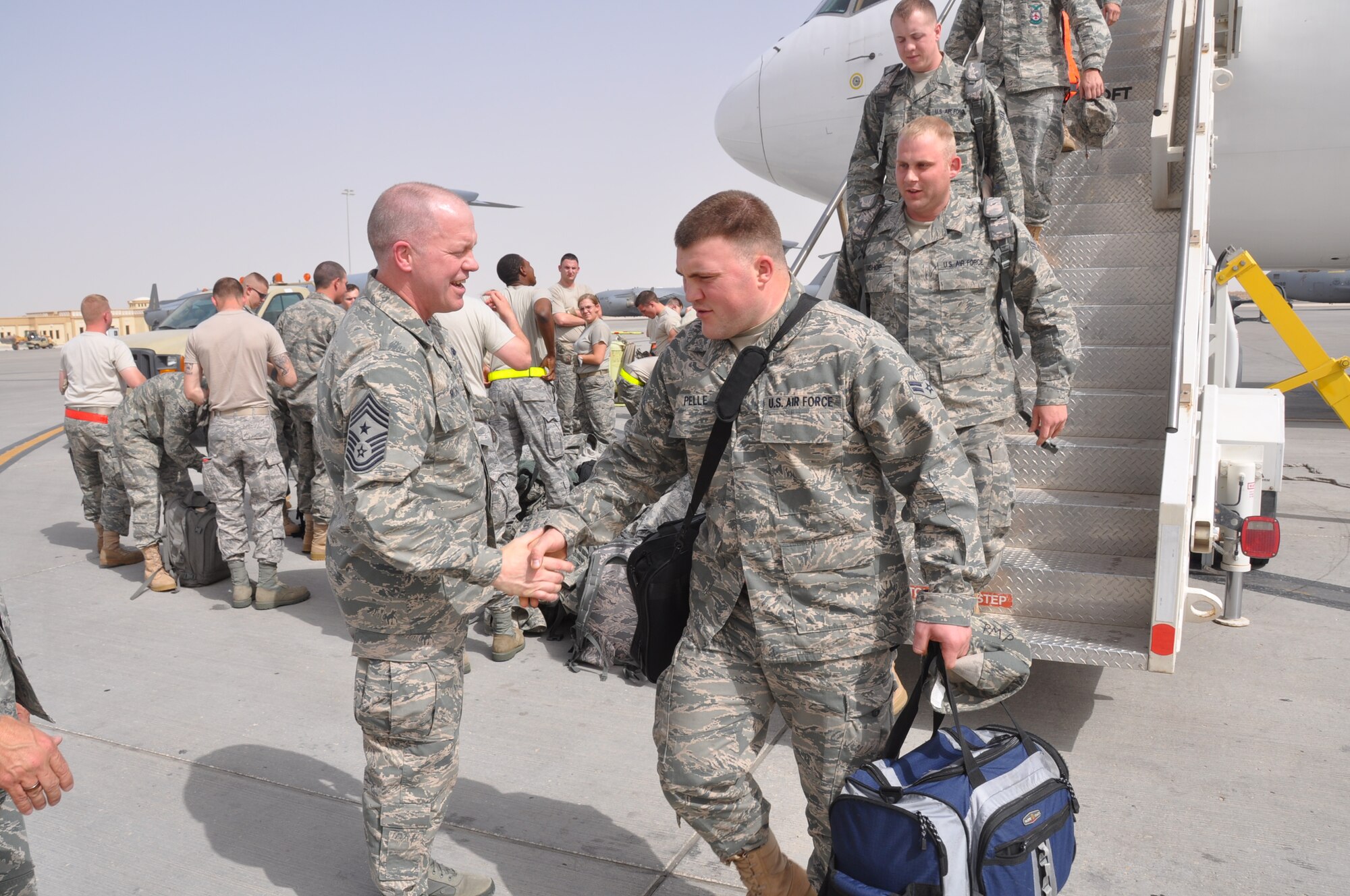 Chief Master Sgt. Chris Muncy, Air National Guard Command Chief, greets
members as they arrive at an undisclosed location in Southwest Asia to serve
throughout the U.S. Air Forces Central area of responsibility. Chief Muncy
was in Southwest Asia to meet with and observe the service of deployed Air
National Guard members. (U.S. Air Force photo/Staff Sgt. Christian Jadot)
