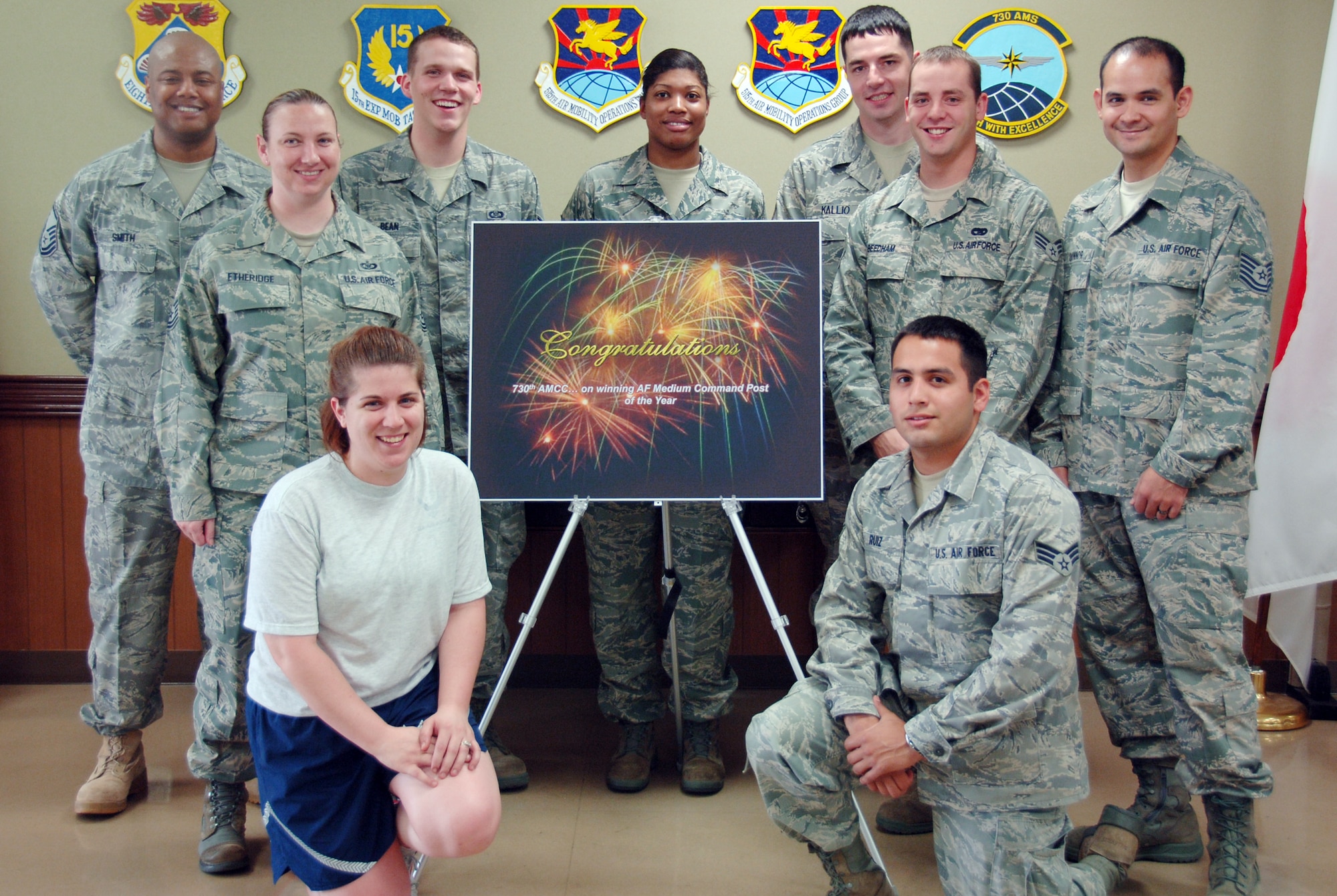 YOKOTA AIR BASE, Japan -- Members of the 730th Air Mobility Squadron Air Mobility Command Center, pose after a congratulatory barbeque at Yokota Air Base, Japan, May 13, 2011. The team celebrated their recent recognition as the Air Force-level Medium Command Post of the Year for 2010. (U.S. Air Force Photo/Airman 1st Class Katrina R. Menchaca)