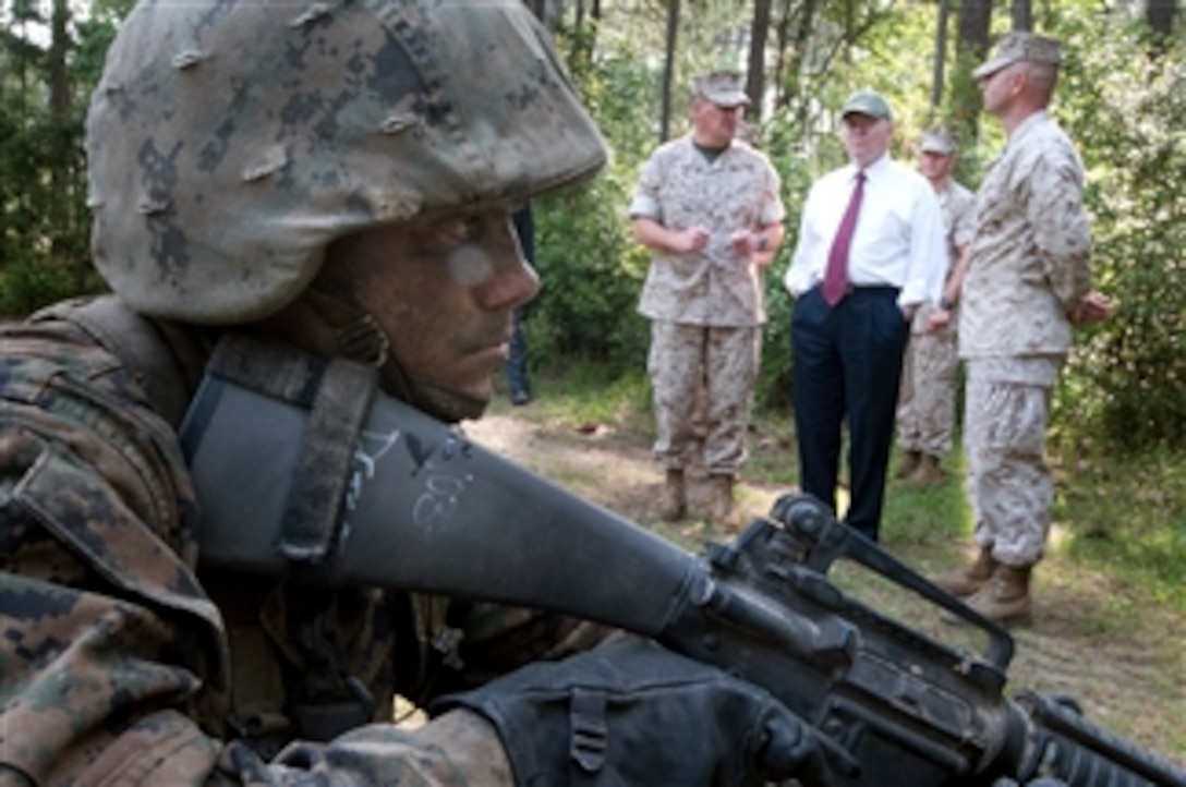 A Marine recruit awaits instruction while Secretary of Defense Robert M. Gates observes The Crucible at Parris Island, S.C., on May 13, 2011.  The Crucible is the final test in recruit training and represents the culmination of the skills and knowledge a Marine should possess.  