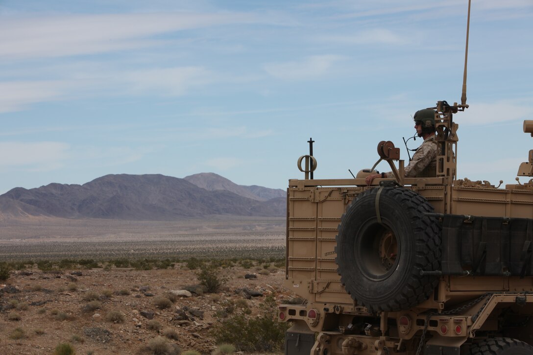 A Marine with U.S. Marine Corps Forces, Special Operations Command, looks out from the back of an M-ATV during a simulated convoy as part of a pre-deployment exercise at the National Training Center, Fort Irwin, Calif. May 15, 2011. The three-week exercise is designed to prepare MARSOC Marines for deployment to combat operations in Afghanistan by immersing them in an environment as realistic and comprehensive as possible.