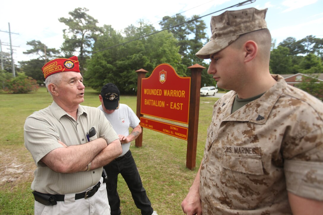 Joe Chasse speaks with Cpl. Matthew Bradford about his injuries and the quality of care he receives at the Wounded Warrior Battalion-East headquarters aboard Marine Corps Base Camp Lejeune, May 17. Chasse and five other members from the Marine Corps Leauge Bucci-Atwood Post 376 traveled from Providence, R.I., to make a donation to the battalion and to ensure the Marines are getting the best care possible.