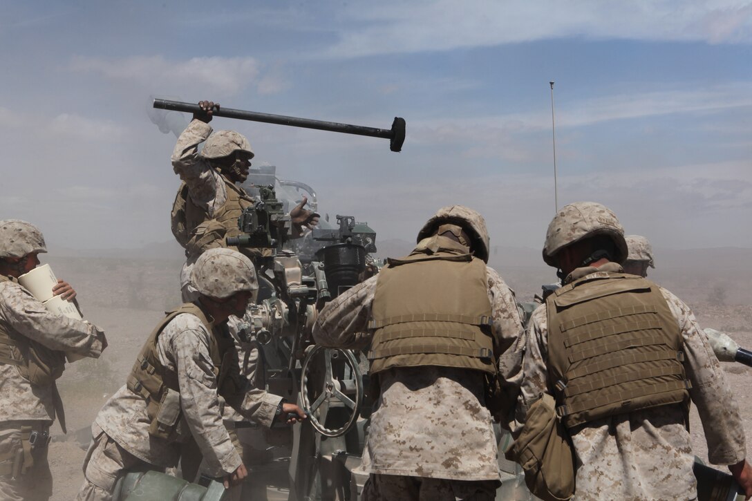 Marines with Mike Battery, 3rd Battalion, 11th Marine Regiment, reload their M777 howitzer during a call for fire for Operation Urban Thunder, at the Combat Center’s training area May 17, 2011. Operation Urban Thunder, a combined arms exercise held by local units and those from Marine Corps Base Camp Pendleton, Calif., is led by Regimental Combat Team 7.