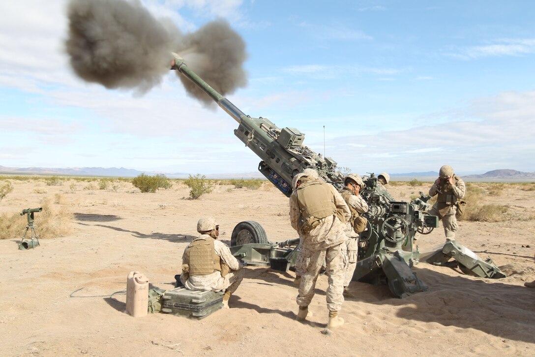 Members of Mike Battery, 3rd Battalion, 11th Marine Regiment, fire their M777 howitzer down range in a call for fire exercise in Regimental Combat Team-7’s Operation Urban Thunder throughout Combat Center’s training areas May 17, 2011.