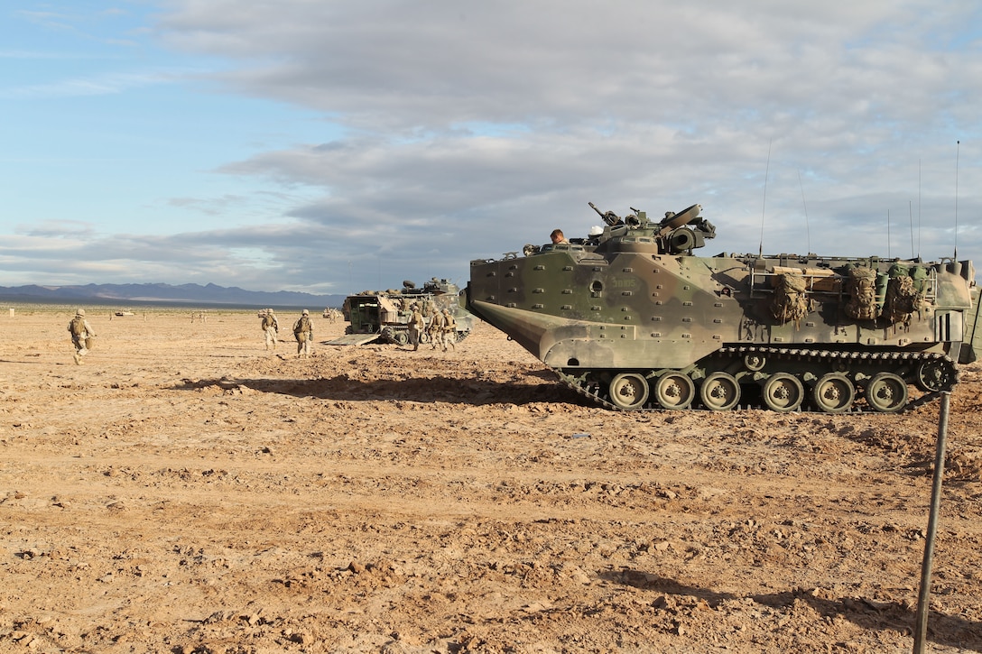 Members of Animal Company 1st Battalion, 7th Marine Regiment ready the Amphibious Assault Vehicles for their march to their objective in their culminating exercise for Operation Urban Thunder in the Blacktop training area May 17, 2011.