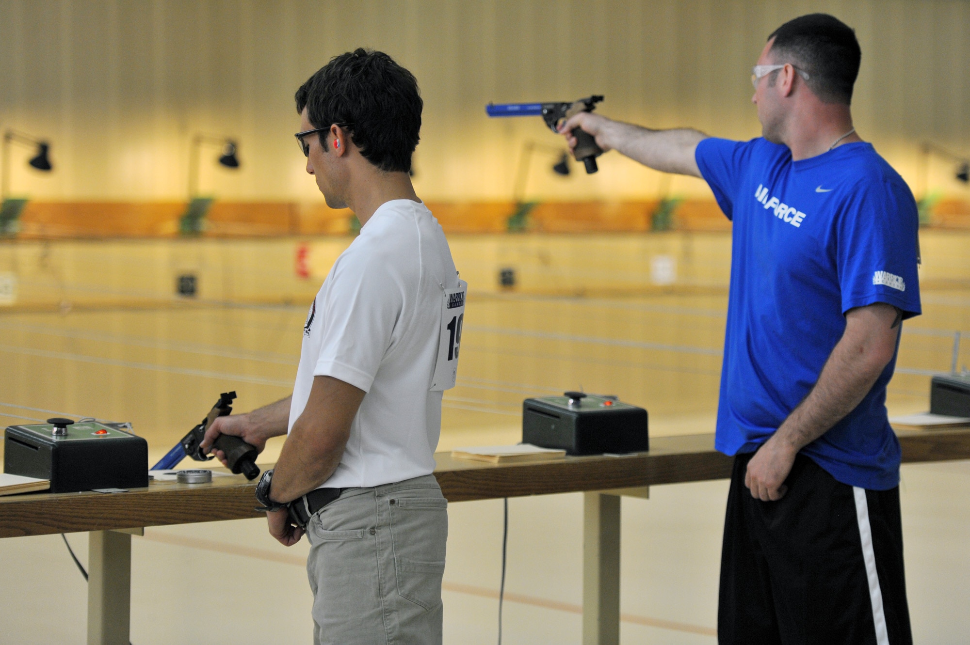 Marc Esposito and Christopher E. D'Angelo take aim in the shooting competition of the 2011 Warrior Games May 17, 2011, at the U.S. Olympic Training Center in Colorado Springs, Colo. More than 200 wounded warriors from all the military services are competing in Paralympic-style athletic events May 16 through 21. (U.S. Air Force photo/Staff Sgt. Desiree N. Palacios)
