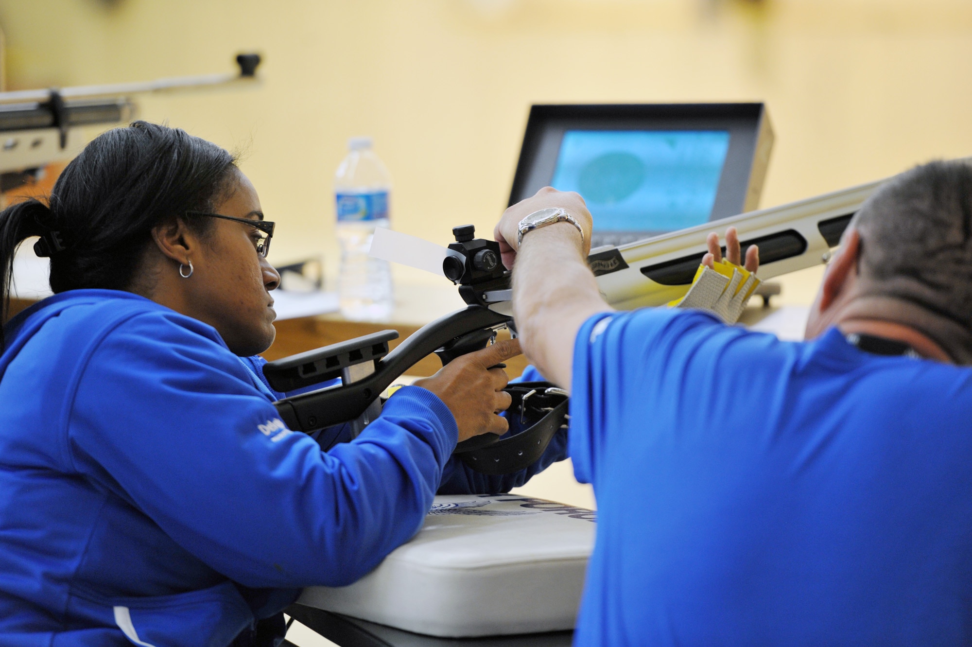 Retired Airman First Class Chatriex Goodson is assisted by Retired
Senior Master Sgt. Noel Sepulveda before taking aim in the shooting
competition of the inaugural Warrior Games at the U.S. Olympic
Training Center in Colorado Springs, Colo., May 17, 2011. Some 200
wounded warriors and disabled veterans from all the military services
are competing in paralympic-style athletic events May 16-21. (U.S. Air
Force photo/Staff Sgt. Desiree N. Palacios)