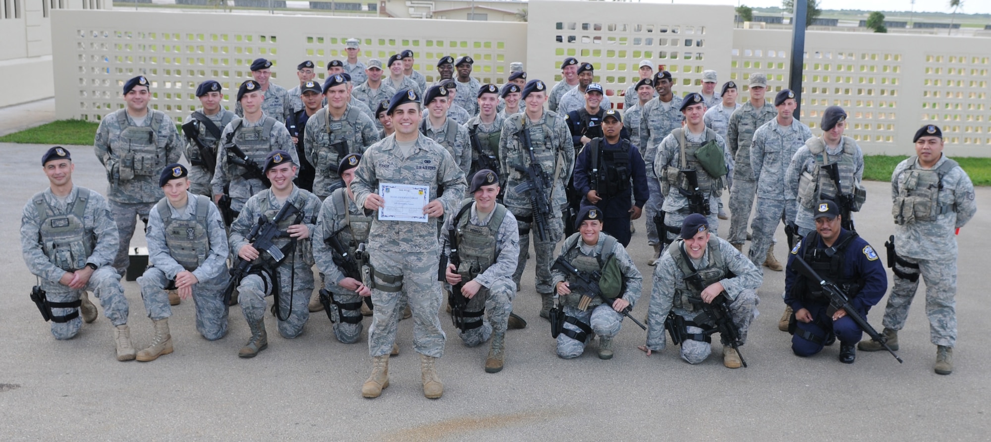 Airman First Class Christopher Turner, 36th Security Forces Squadron security controller, poses with his squadron after being awarded Team Andersen’s Best here May 13. 