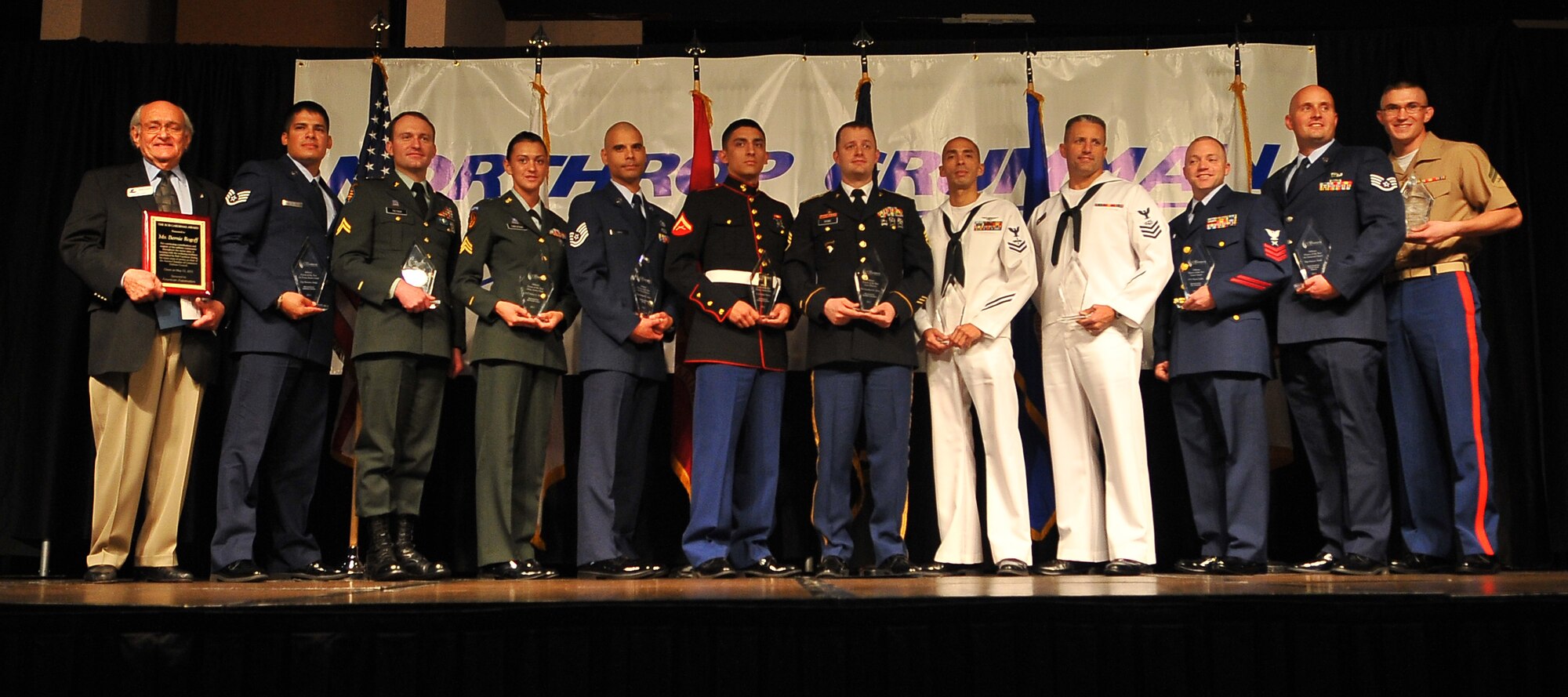 AURORA, Colo. -- Winners of the 38th Annual Armed Forces Recognition Luncheon gather for a group photo at the Crown Plaza Hotel, May 13, 2011. The AFRL, hosted by the Aurora Chamber of Commerce, recognizes 11 local military leaders from all branches of service. (U.S. Air Force photo by Staff Sgt. Kathrine McDowell)