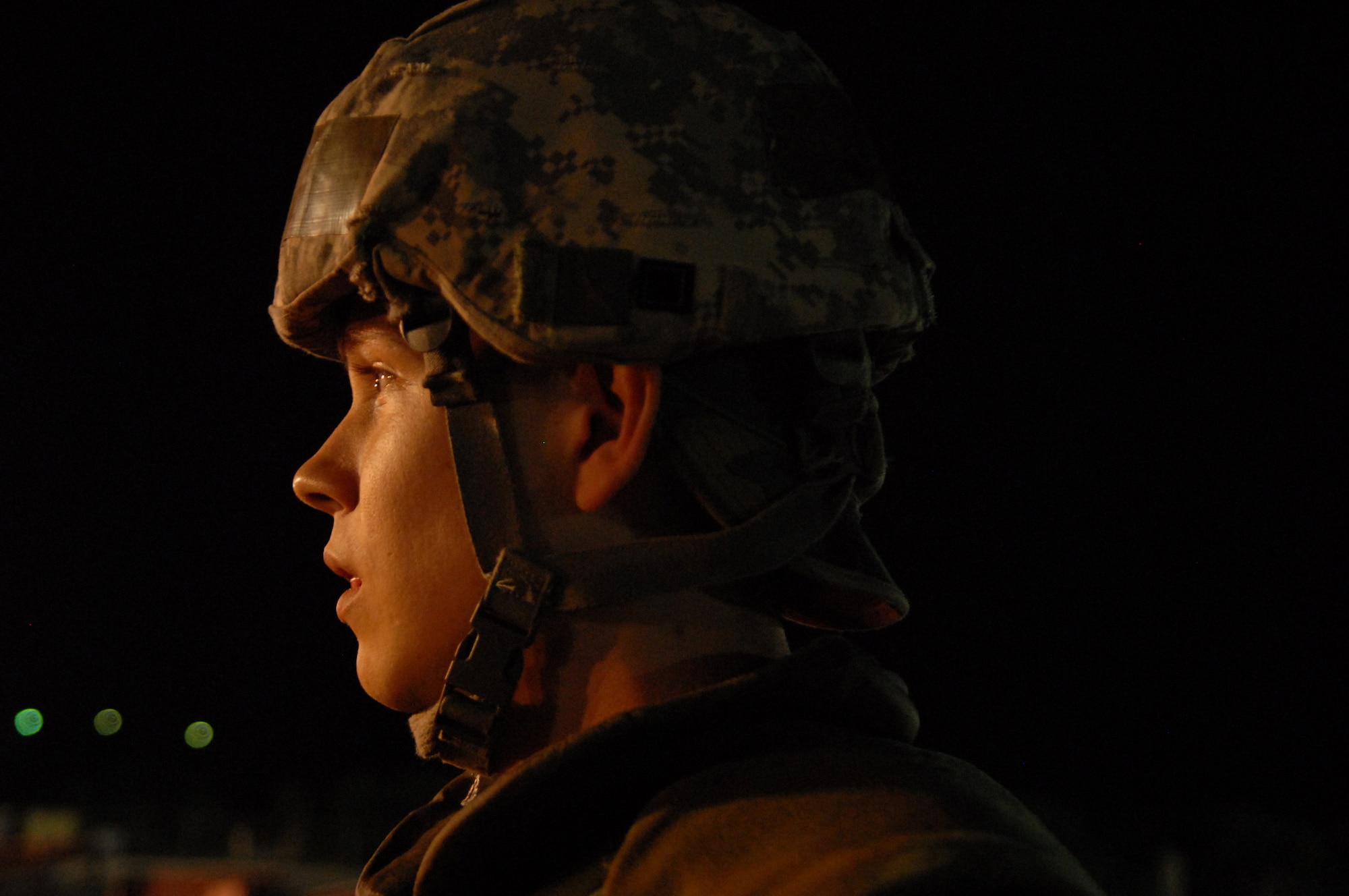 Senior Airman Cristofer Mercado, 18th Logistics Readiness Squadron passenger travel clerk, observes as fellow Airmen from the 18th LRS transport simulated cargo as part of a local operational readiness exercise, Beverly High 11-4, May 18, at Kadena Air Base, Japan. Almost all Airmen at Kadena participate in the LORE to hone skills and keep them sharp in case of real-world emergencies. (U.S. Air Force photo/Senior Airman Sara Csurilla)