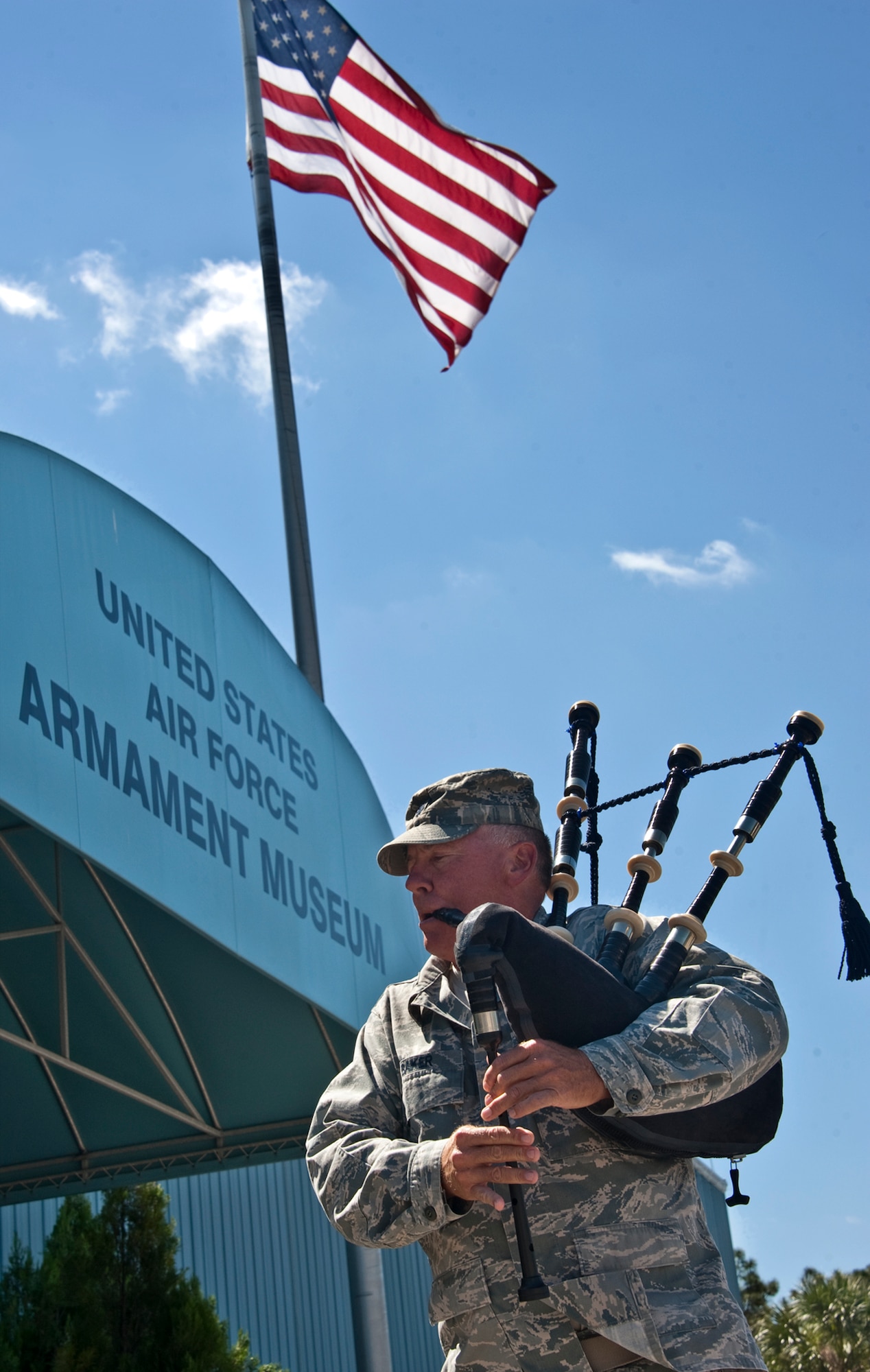 Lt. Col. Ken Baker, 919th Mission Support Group, performs “Amazing Grace” on his bagpipes during the Military Working Dog memorial ceremony May 17 at the Air Armament Museum.  The ceremony honored MWDs and civilian K-9 unit for their service and remembered those who’ve fallen.  The ceremony was just one of the events happened for Police Week.  (U.S. Air Force photo/Samuel King Jr.)    