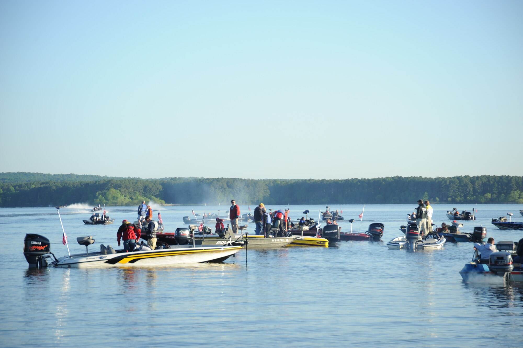 Particpants in the 6th Annual Warriors on the Water Fishng Tournament gather for the official start at Jordan Lake, N.C. For many of the Soldiers this will be their first opportunity to go fishing  on  Lake Jordan. The skies are sunny, light breeze, and smooth waters just right for the big bass. Grab your pole! (U.S. Air Force Photo by Jerry Green)