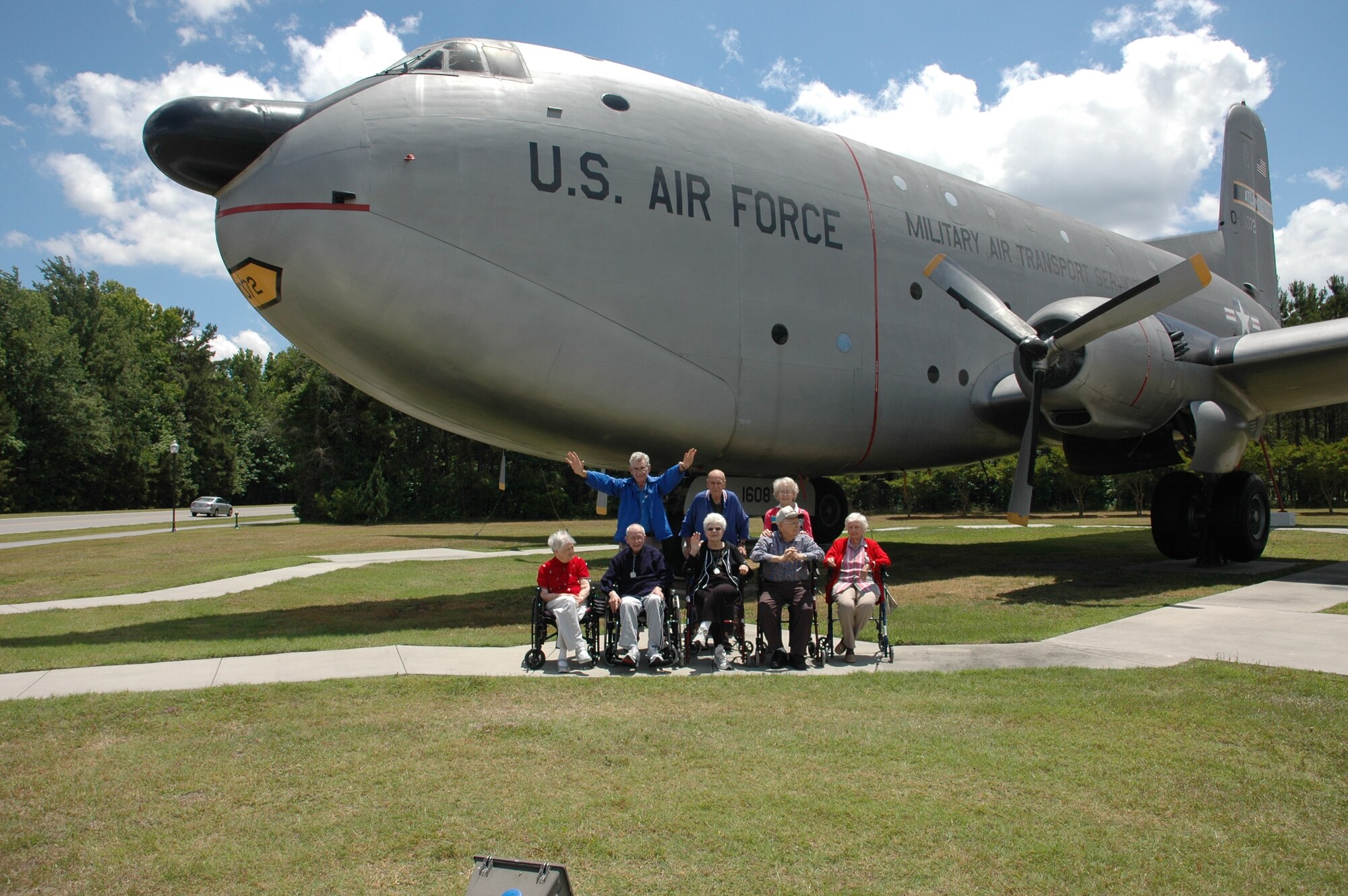 Members of the Sweetgrass Retirement Village stand infront of the C-124 Globemaster II during their tour to Joint Base Charleston.