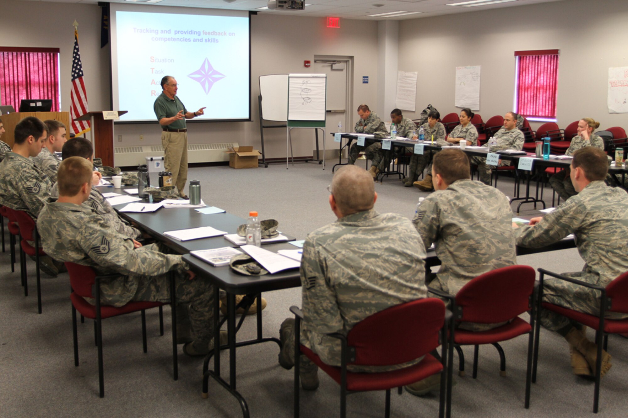 Retired Air Force Colonel George Updegrove instructs 25 Sergeants during the Noncommissioned Officer Leadership Development Course at the 911 Airlift Wing. This two week course, mandated by Texas College, includes a six day training program which prepares leaders to efficiently communicate with their personnel. (U.S. Air Force photo/Tech. Sgt. Ralph VanHoutem)
