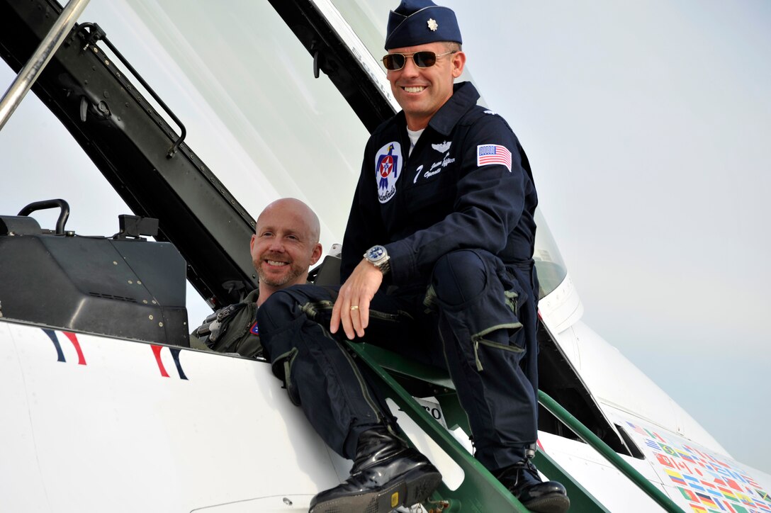 Lieutenant Colonel Jason Koltes, #7 Thunderbirds pilot, and Scott Roewer, hometown hero, pose in the #7 Thunderbirds jet prior to Mr. Roewer's hometown hero incentive flight May 16. Mr. Roewer received the incentive flight for his extensive contributions to his community in Washington, DC. His efforts included volunteering for an organization that helps underprivileged persons attain job skills and business attire so that they may enter the workforce. He also collected more than 6,000 pairs of shoes to be donated to the earthquake victims in Haiti through the Souls4Souls charity. (U.S. Air Force Photo by Senior Airman Perry Aston) (Released)