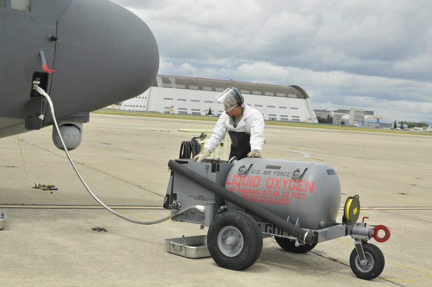 California Air National Guard Airman 1st Class Vandy Chan, an aerospace maintenance apprentice assigned to the 129th Aircraft Maintenance Squadron refills the MC-130P Combat Shadow liquid oxygen system at Moffett Federal Airfield, Calif., May 16, 2011. The LOX system enables the crew to breath at high altitude. (California Air National Guard photo by Staff Sgt. Kim E. Ramirez)