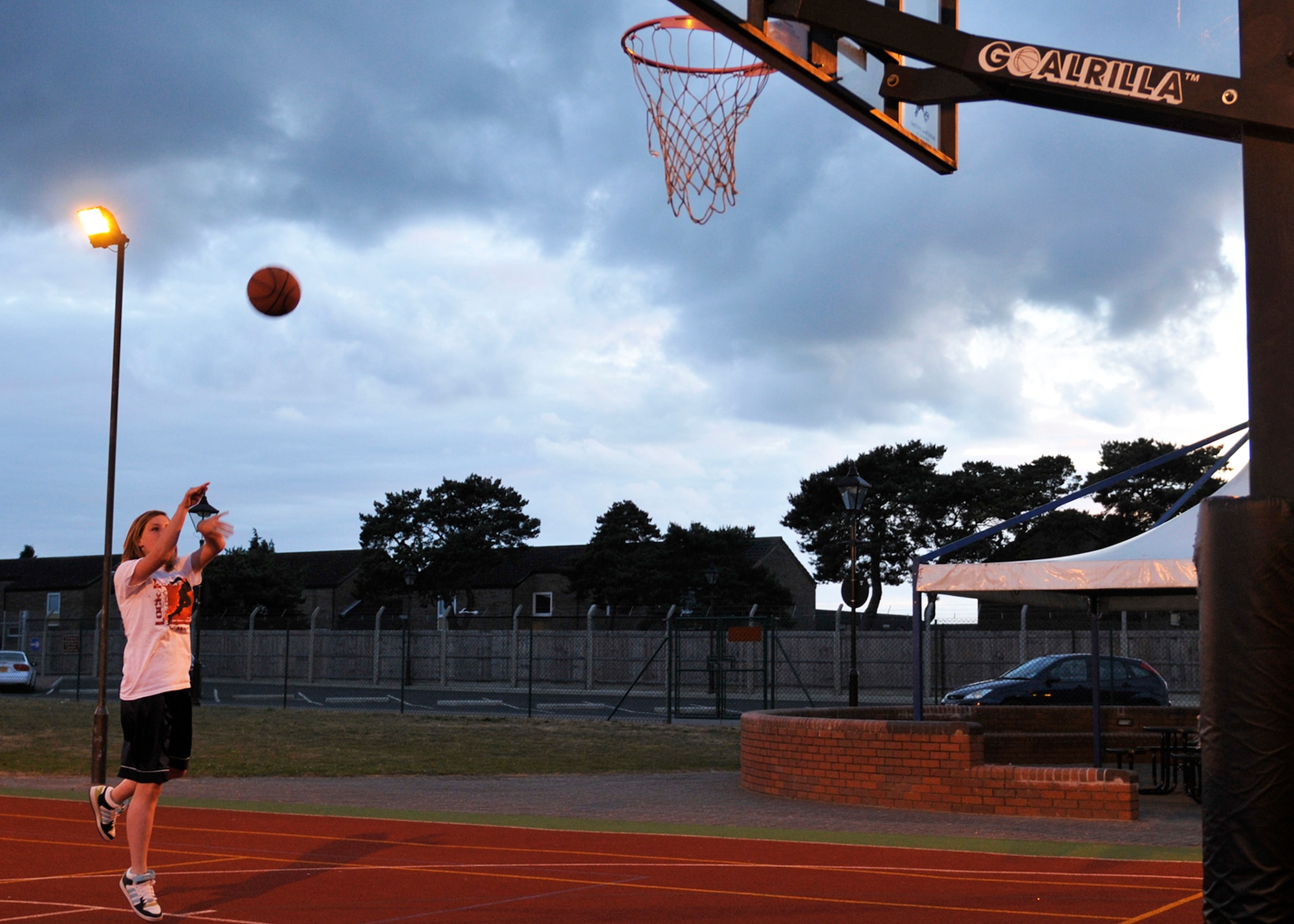 ROYAL AIR FORCE LAKENHEATH, England - Ashleigh Kerr, a Lakenheath High School 9th grader, shoots a basketball during a "Teen Lock-In Max Out" at the RAF Lakenheath Youth Center on May 13, 2011. Students participated in basketball, wallyball, dodgeball, frisbee football and various other events. Nearly 70 bases participated in the Air Force-wide event. During the event, the bases could call and challenge another base to various events, such as who could perform the most push-ups or free throws in a minute. (U.S. Air Force photo/Senior Airman Tiffany M. Deuel)