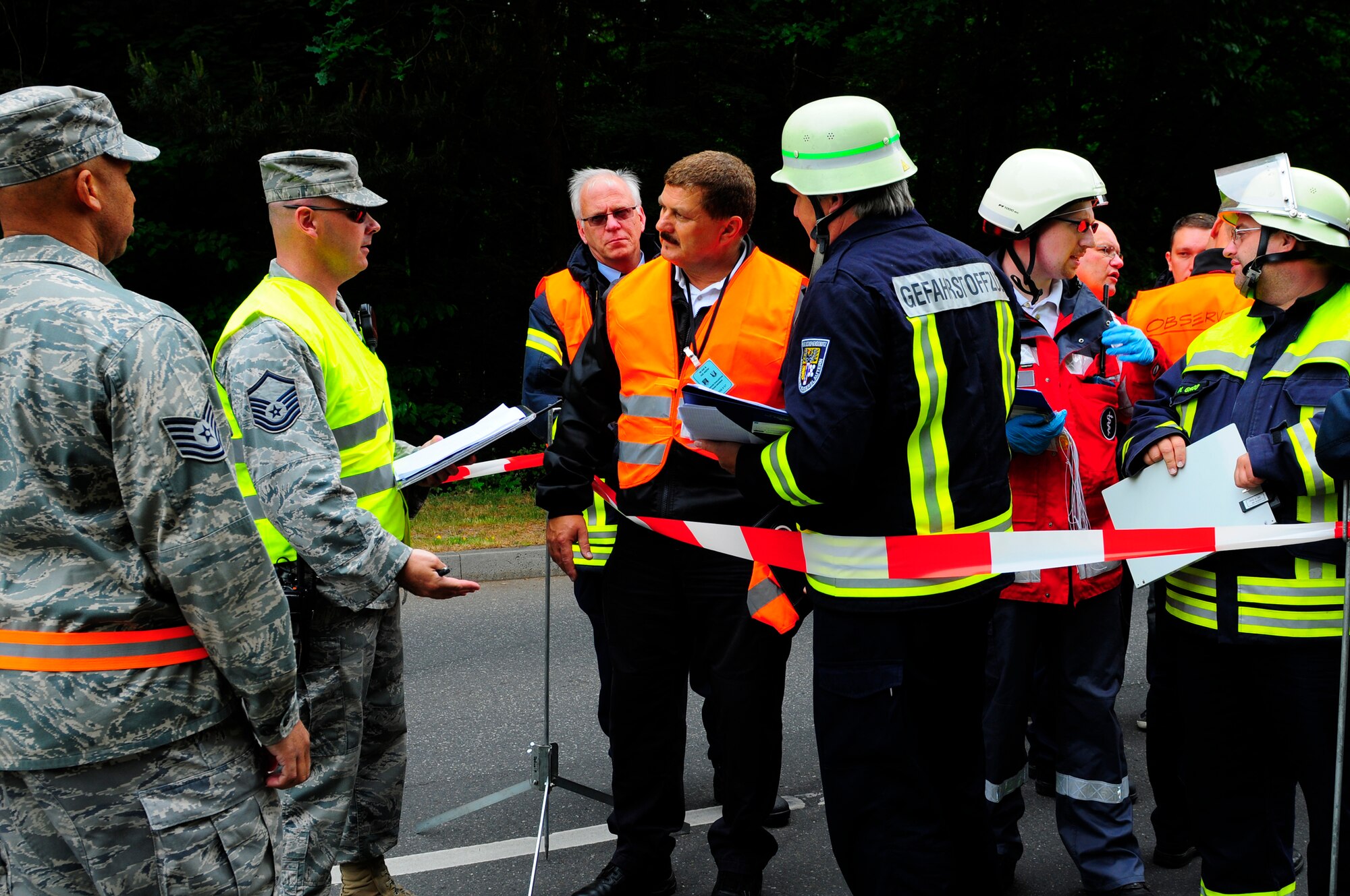 U.S. Air Force and German exercise evaluators conduct an after action review during an operational readiness exercise on Ramstein Air Base, Germany, May 17, 2011. More than 100 German first responders and observers participated in the 86th Airlift Wing and 435th Air Ground Operations Wing hosted exercise May 16 to 19. An ORE incorporates a series of scenarios to evaluate a base's ability to execute operational duties under simulated wartime conditions. (U.S. Air Force Photo by Airman 1st Class Brea Miller)