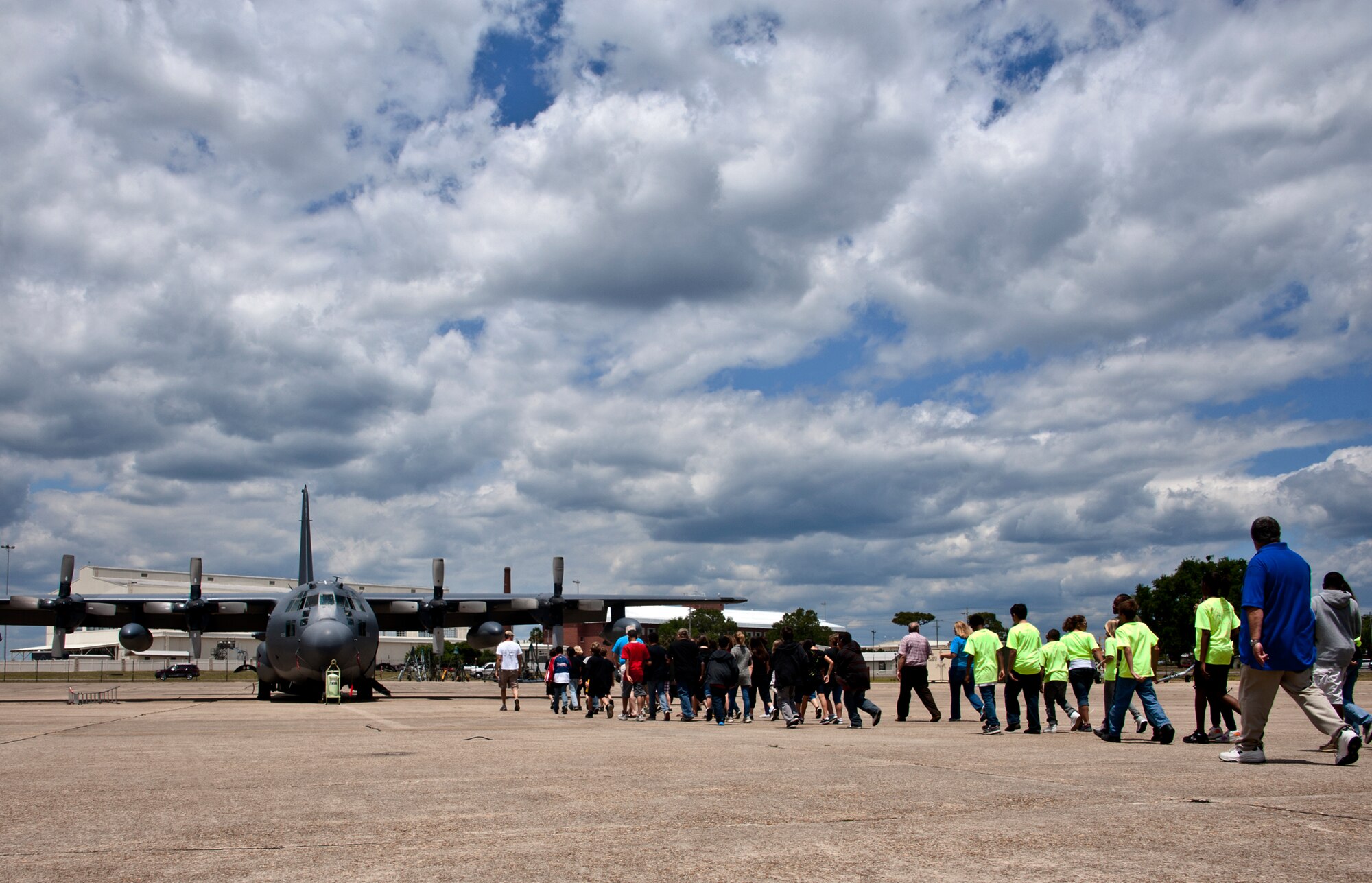 A group of kids walk out toward an MC-130E Combat Talon for a tour of the aircraft during the Marsville event May 16. Children were asked to create a project using only recyclable materials that would solve a core component problem of living on Mars. More than 120 students from Wright, Longwood Elementary and Lewis Middle schools gathered on Eglin for a single mission: build a life-sustaining pod on Mars. The 16th annual event is a collaborative effort between Eglin and the surrounding community's elementary school fifth-grade students, and faculty members. One of its top goals is to encourage students to pursue careers in science and engineering.  (U.S. Air Force photo/Samuel King Jr.)

