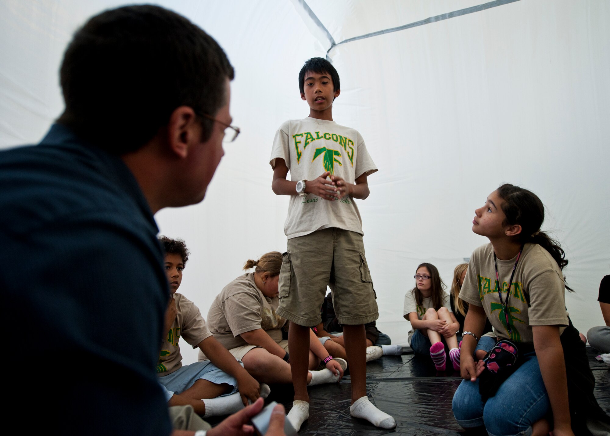 Kids from Lewis Middle School talk about their new living conditions inside their Pod during Eglin’s annual “Marsville” event for local fifth graders May 16.  More than 120 students from Wright, Longwood Elementary and Lewis Middle schools gathered on Eglin for a single mission: build a life-sustaining pod on Mars. The 16th annual event is a collaborative effort between Eglin and the surrounding community's elementary school fifth-grade students, and faculty members. One of its top goals is to encourage students to pursue careers in science and engineering.  (U.S. Air Force photo/Samuel King Jr.)