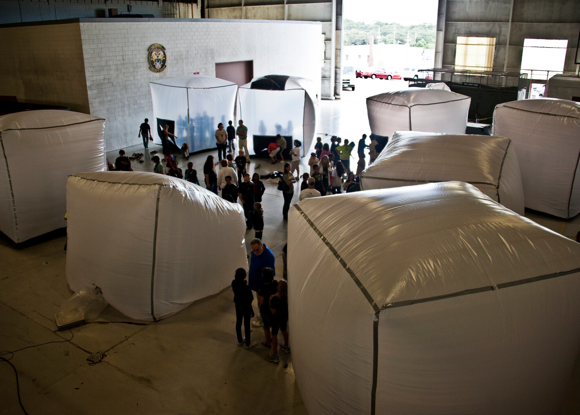 Pods began to grow and form in Hangar 422 during Eglin’s annual “Marsville” event for local fifth graders May 16.  More than 120 students from Wright, Longwood Elementary and Lewis Middle schools gathered on Eglin for a single mission: build a life-sustaining pod on Mars. The 16th annual event is a collaborative effort between Eglin and the surrounding community's elementary school fifth-grade students, and faculty members. One of its top goals is to encourage students to pursue careers in science and engineering.  (U.S. Air Force photo/Samuel King Jr.)