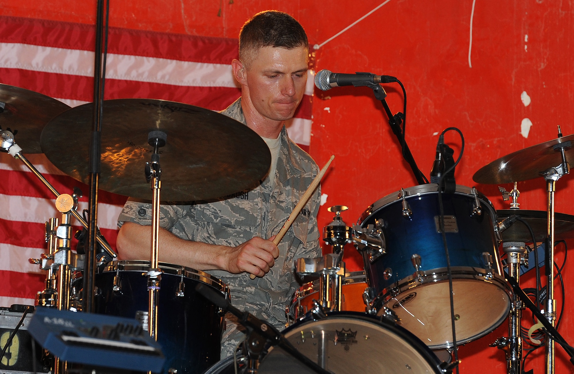 Tech. Sgt. Tim Stombaugh of "Wild Blue Country" U.S. Air Forces Central Band, plays the drums during a concert for troops at an undisclosed location in Southwest Asia, May 16. (U.S. Air Force photo/Staff Sgt. Liliana Moreno)                     