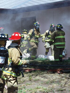 U.S. Air Force Academy firefighters respond to a fire in military family housing.  The Academy Fire Department was recently named the Air Force's medium-sized fire department of the the year for 2010.  (Courtesy Photo)