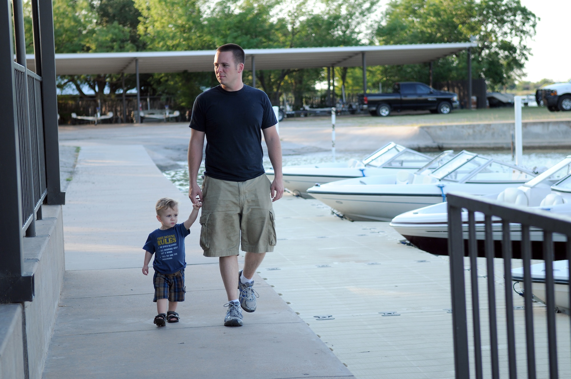 GOODFELLOW AIR FORCE BASE, Texas --Staff Sgt. Adam Rodgers an instructor with the 315th Training Squadron takes his son Nicolas for a walk at Goodfellow's Recreation Camp on Lake Nasworthy, May 14. The 17th Force Support Squadron's Outdoor Recreation Center offers various activities for all ages. 
(U.S. Air Force photo/Staff Sgt. Heather L. Rodgers)


