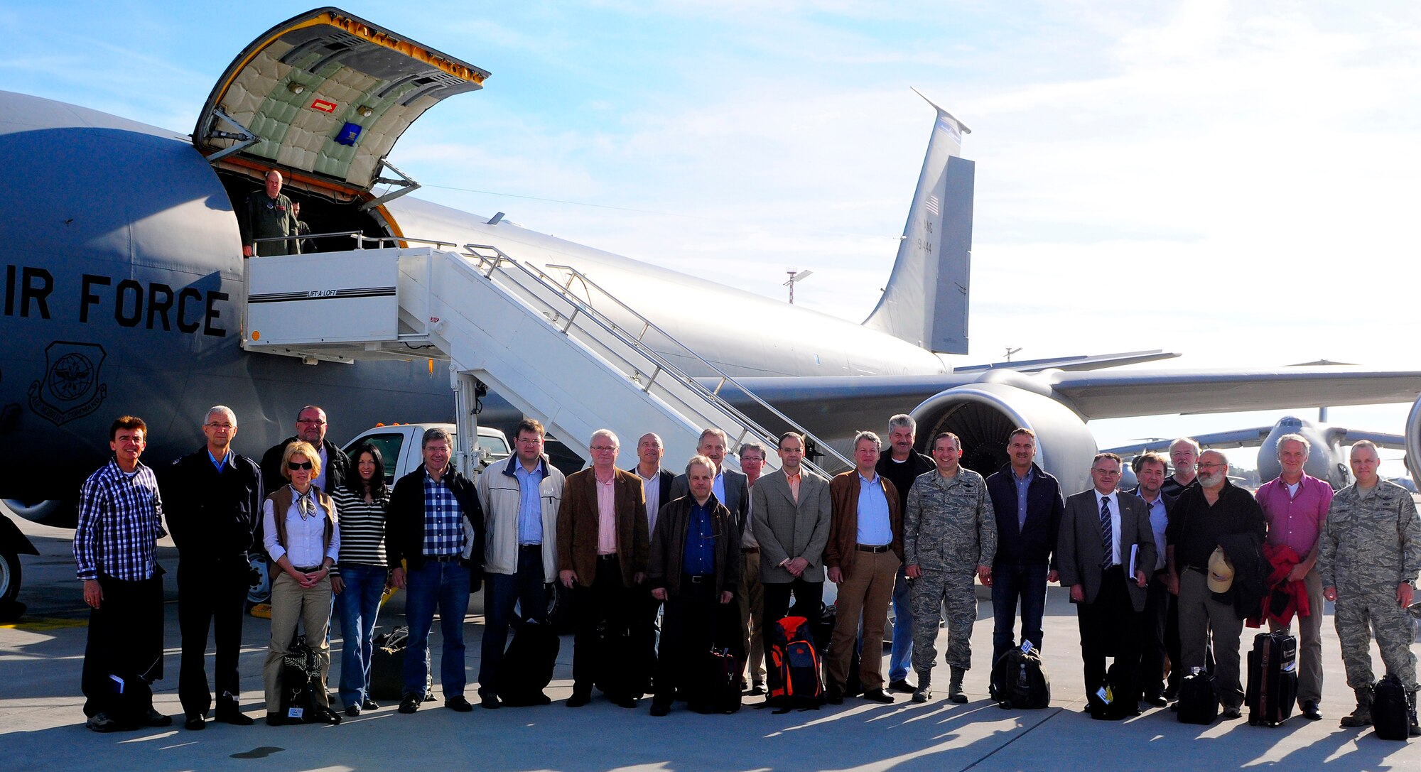 Participants of the Civic Leader Tour 2011 pose for a photo on the flightline, Ramstein Air Base, Germany, May 9, 2011. United States Air Forces in Europe vice Commander, Lt. Gen. Stephen Mueller, escorted 17 host nation civic leaders on a four-day-tour to five USAF installations to highlight Ramstein's importance to the diversity of AF missions. (U.S. Air Force Photo by Airman 1st Class Brea Miller)