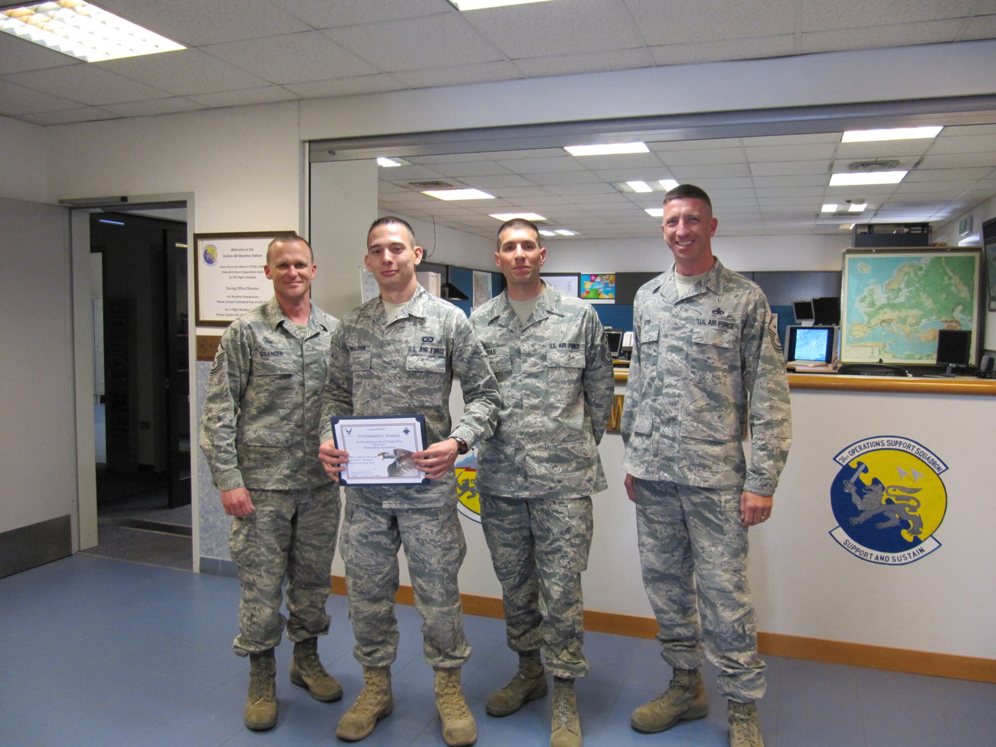 Airman 1st Class Nathaniel Penalosa, 31st Operations Support Squadron airfield management operations coordinator, is presented the Diamond Sharp award for March by the Aviano First Sergeants Council. The Diamond Sharp award is designed to recognize Aviano Airmen who distinguish themselves through outstanding professionalism, impeccable appearance and a "can do" attitude. (Courtesy photo)