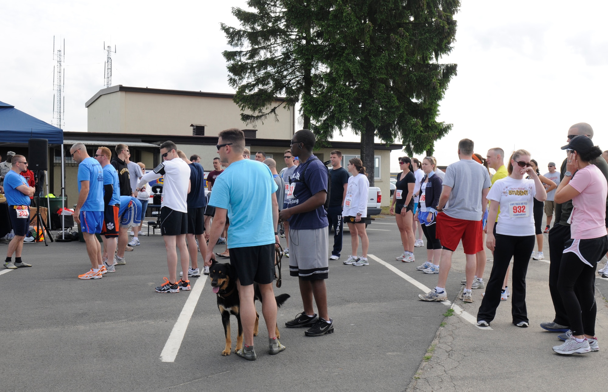 SPANGDAHLEM AIR BASE, Germany – Runners wait for the start of the 10K and U.S. Air Forces in Europe half marathon to begin here in the parking lot next to the Skelton Memorial Fitness Center May 14. The USAFE half marathon is an annual event Airmen from around Europe can participate in. Each run offered were split into different categories based on age and gender. (U.S. Air Force photo/Airman 1st Class Brittney Frees)