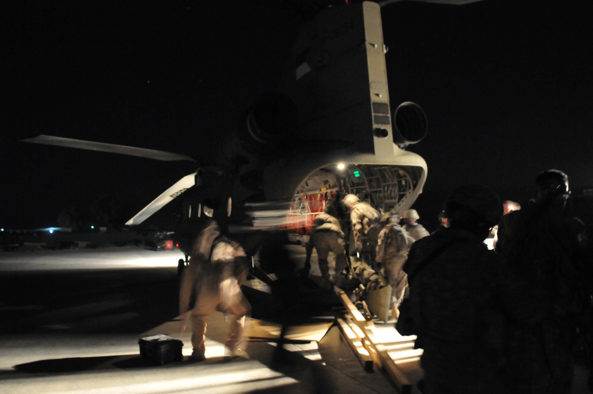 Jalalabad, Afghanistan. Army Pathfinders of Fox Company, 2nd Battalion, 10th Combat Aviation Brigade Fort Drum, NY load onto a CH-47 Chinook to travel to the site of a Afghan Air Force Mi-17 helicopter crash in the Nuristan province, Afghanistan. The Pathfinders are tasked to provide security around the perimeter and disassemble the aircraft so it can be sling loaded by a CH-47 Chinook and taken to an airbase. Photo by Tech Sgt. Brian E. Christiansen.