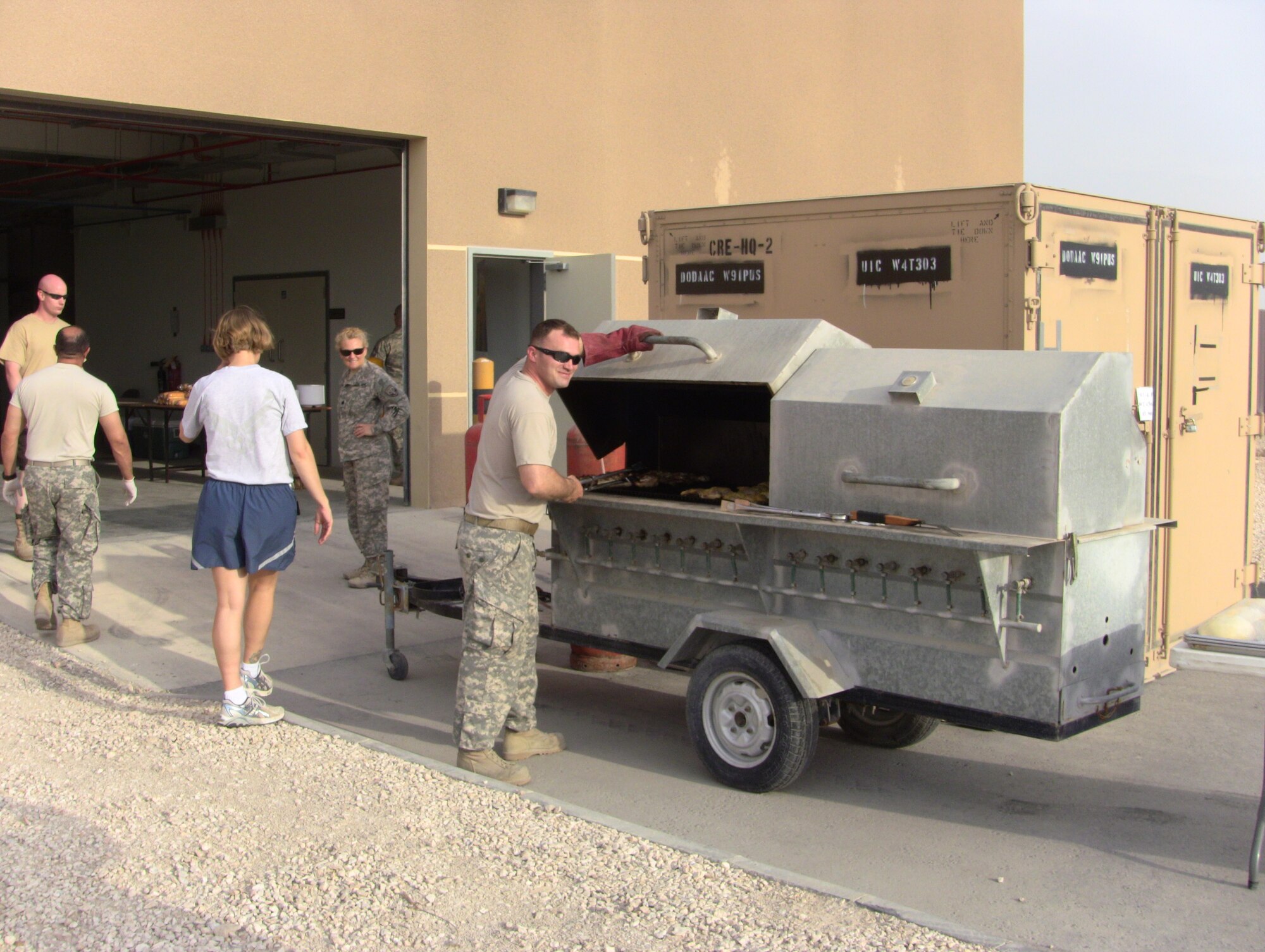 Sgt. Singleton works the grill for the BBQ!
