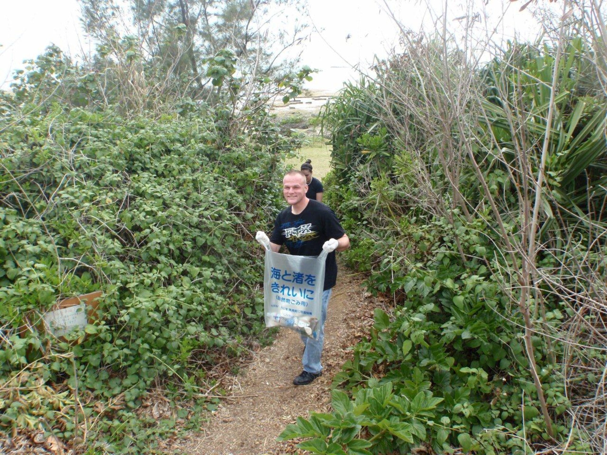 Kadena Air Base Airmen and local nationals from the 18th Logistical Readiness Squadron volunteer to clean up Cape Zanpa Beach Park. (U.S. Air Force/Courtesy Photo)