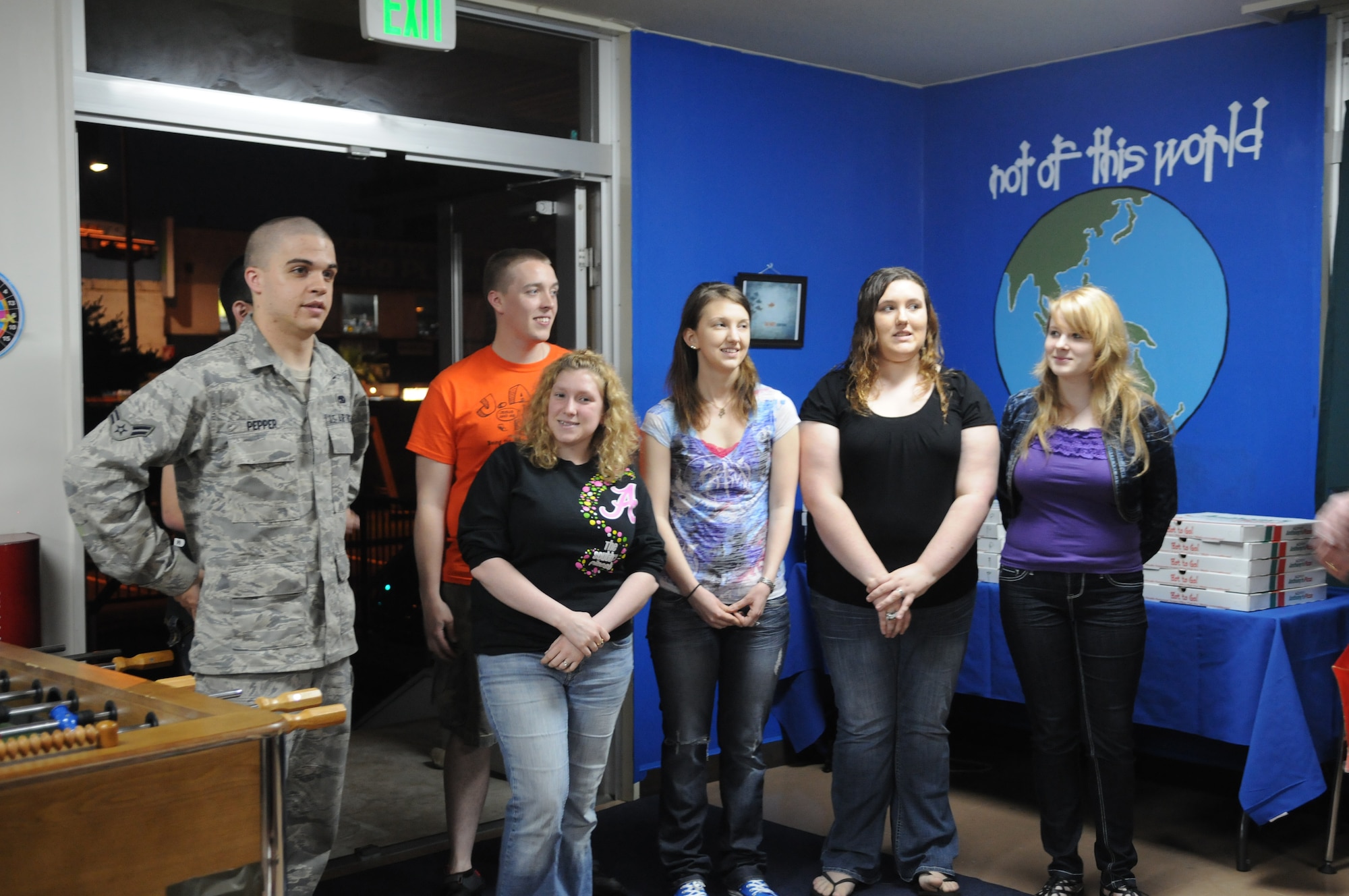 YOKOTA AIR BASE, Japan -- Team Yokota volunteers talk about the Airman Recreation Center at the center's grand opening at Yokota Air Base, Japan, May 13, 2011. The volunteers painted walls and helped establish the center as a social hotspot for junior enlisted members and young dependents 18 and over who have graduated high school. (U.S. Air Force photo/Airman 1st Class Krystal M. Garrett)