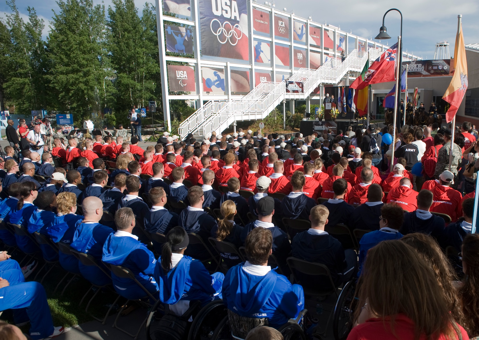 Teams representing the Army, Marine Corps, Navy and Coast Guard, Air Force and Special Operations Command sit May 16, 2011, during the 2011 Warrior Games opening ceremony at the Olympic Training Center in Colorado Springs, Colo. (U.S. Air Force photo/Staff Sgt. Christopher Griffin)