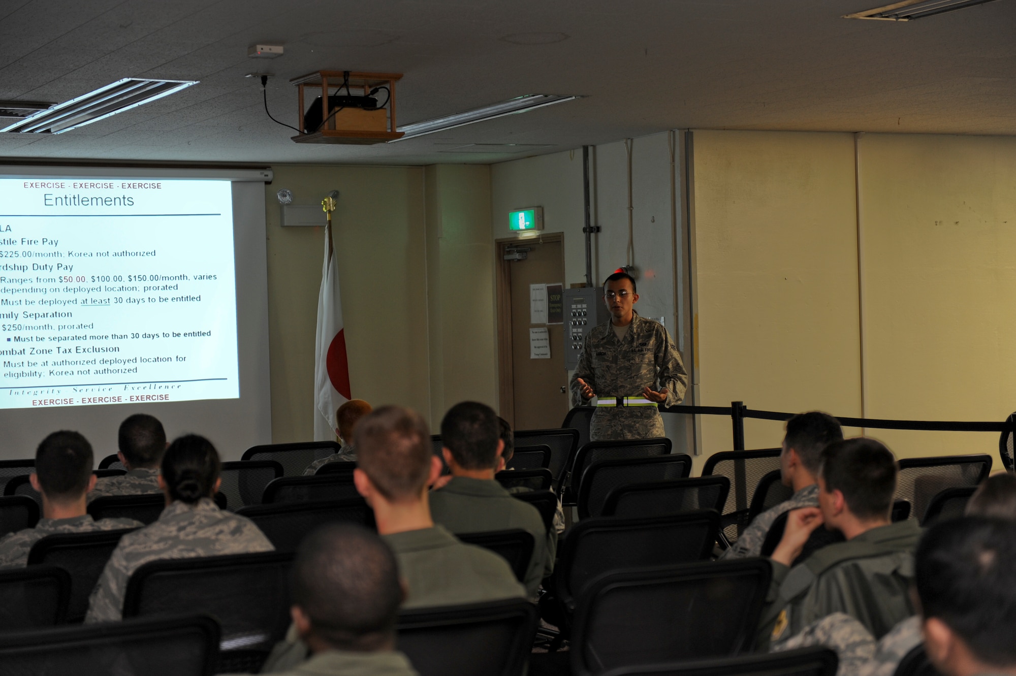 Airman 1st Class Anthony Garcia, 18th Wing Comptroller Squadron, briefs Airmen playing in the Kadena Air Base Local Operations Readiness Exercise about Operational Security May 16.  The Beverly High 11-04 LORE is an exercise involving the entire base to help ready Airmen for possible real-world situations. (U.S. Air Force photo/ Airman 1st Class Brooke Beers)