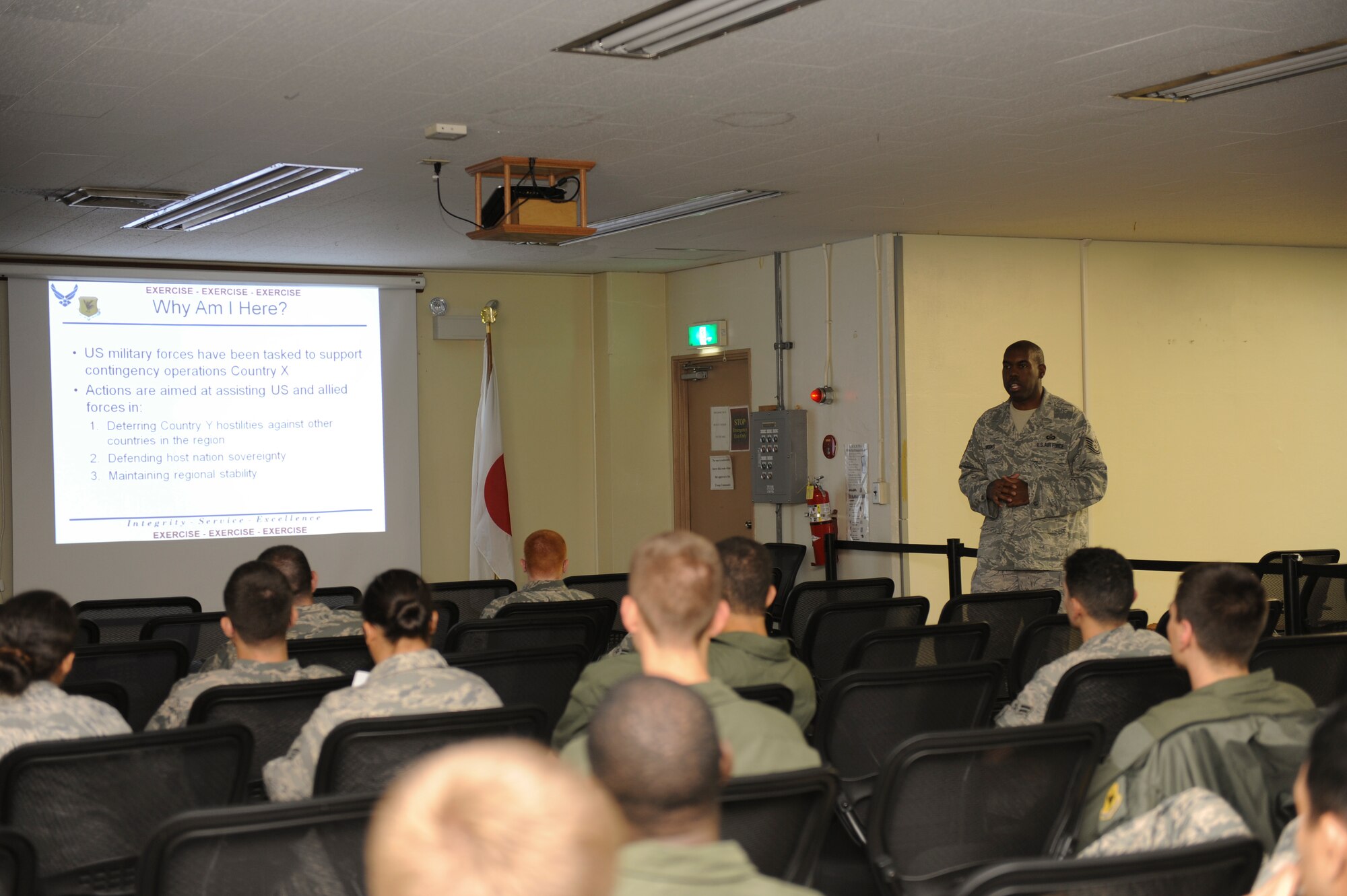 Tech. Sgt. Raynard Brooks, Airman and Family Readiness Center, briefs Airmen playing in the Kadena Air Base Local Operations Readiness Exercise about Operational Security May 16. The Beverly High 11-04 LORE is an exercise involving the entire base to help ready Airmen for possible real-world situations. (U.S. Air Force photo/ Airman 1st Class Brooke Beers)