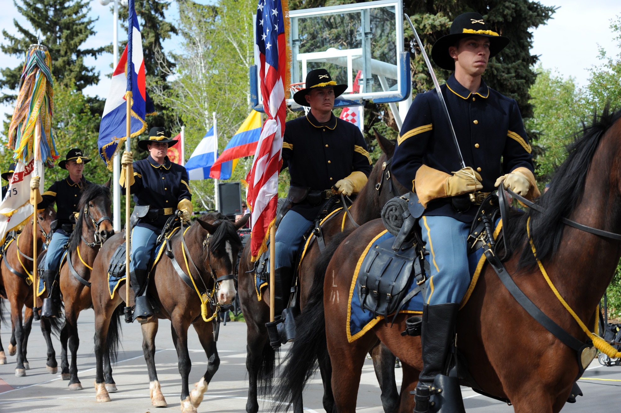 Members of the Ft. Carson Mounted Color Guard travel down the Olympic Pathway May 16, 2011, during the 2011 Warrior Games opening ceremony at the U.S. Olympic Training Center in Colorado Springs, Colo. Some 200 wounded warriors and disabled veterans from all the military services are competing in paralympic-style athletic events May 16 through May 21. (U.S. Air Force photo/Staff Sgt. Desiree N. Palacios)
