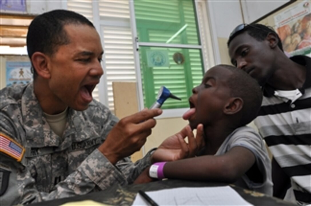 U.S. Army Capt. Vincent Fry performs a check on a child from Obock, Djibouti, during a recent medical capacity program mission on May 5, 2011.  Fry and other medical experts from Combined Joint Task Force - Horn of Africa treated more than 1,800 patients for a variety of ailments during the two-day program.  