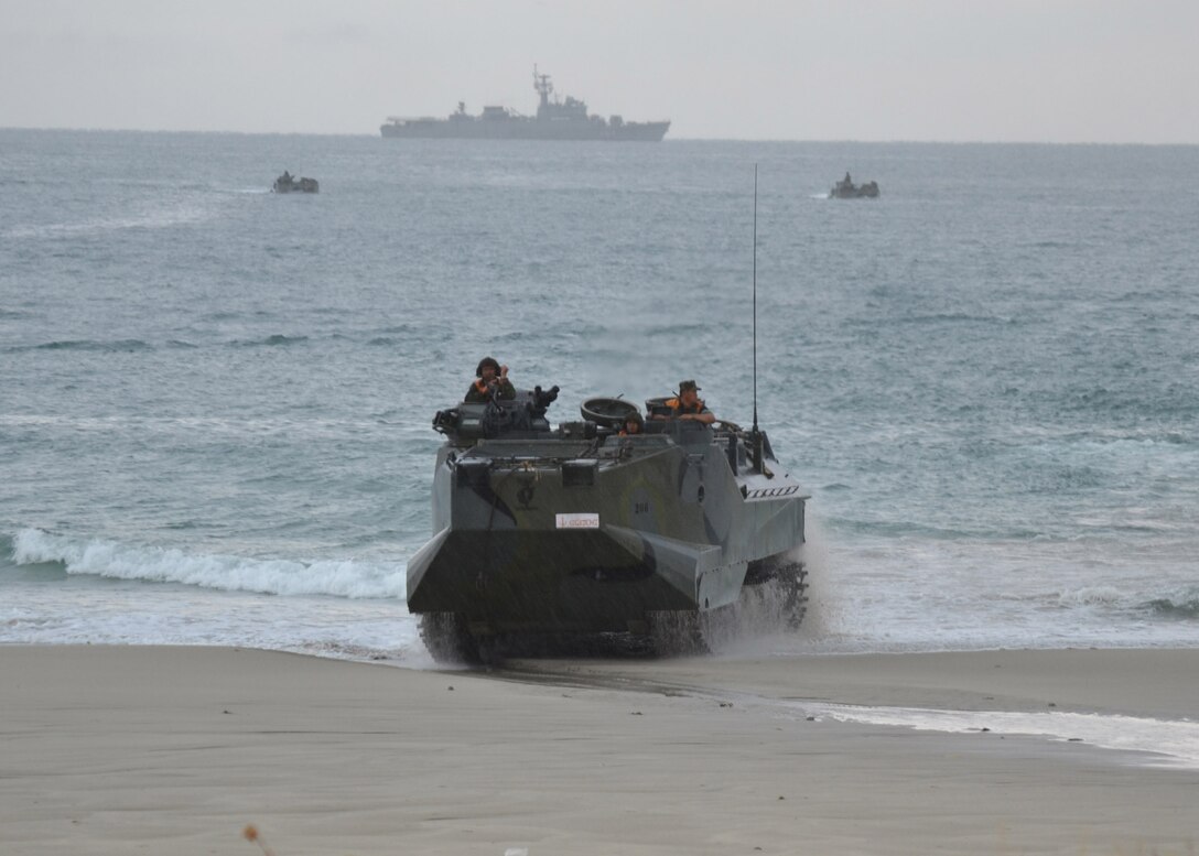 A Royal Thai Marine Corps amphibious assault vehicle drives on to the beach during an amphibious assault exercise May 18 as part of Cooperation Afloat Readiness and Training (CARAT) 2011. The navy medium landing ship HTMS Surin (LST 722), not pictured, along with the dock landing ship USS Tortuga (LSD 46), simultaneously delivered amphibious assault vehicles in the bilateral training exercise. CARAT is a series of bilateral exercises held annually in Southeast Asia to strengthen relationships and enhance force readiness.