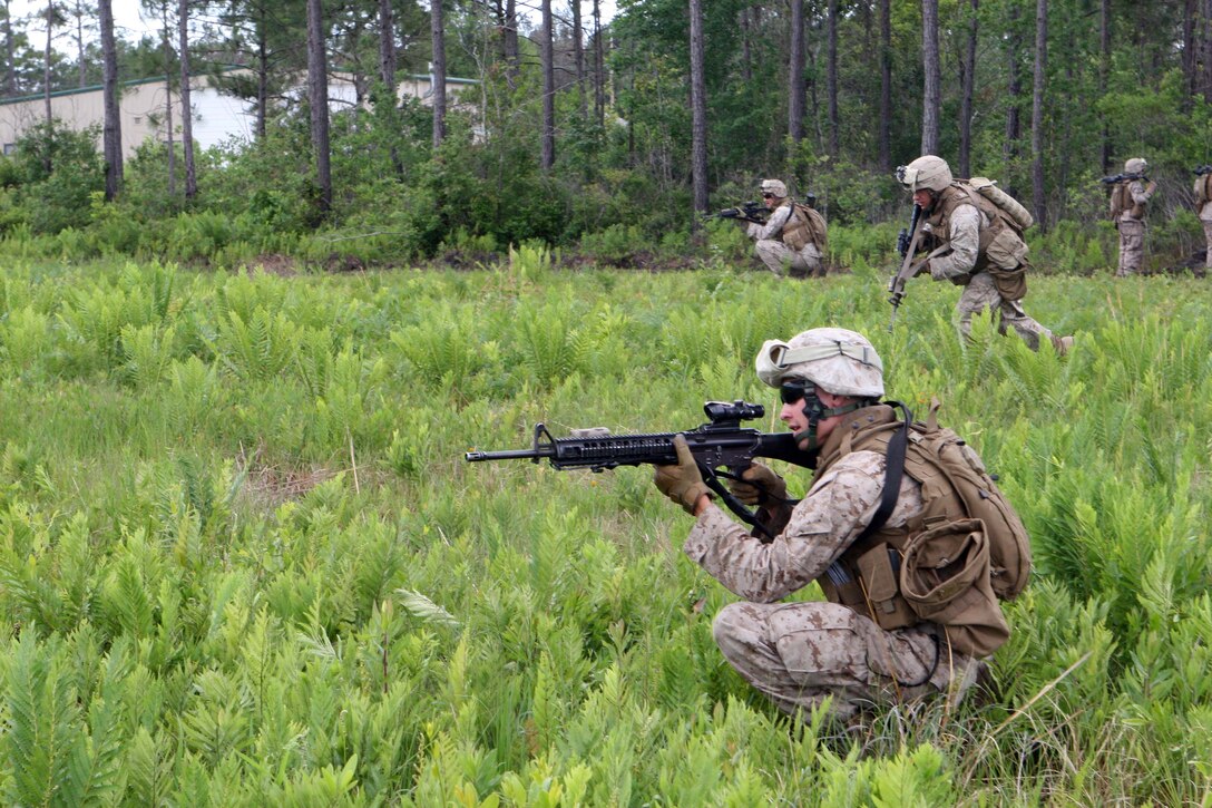 Marines with Company G, 2nd Battalion, 6th Marine Regiment, 2nd Marine Division, practice their fire team attacks aboard Marine Corps Base Camp Lejeune N.C, May 18, 2011. The training lasted three days and was used to focus on fire team cohesion and maneuvers. (U.S. Marine Corps photograph by Lance Cpl. Walter D. Marino II)