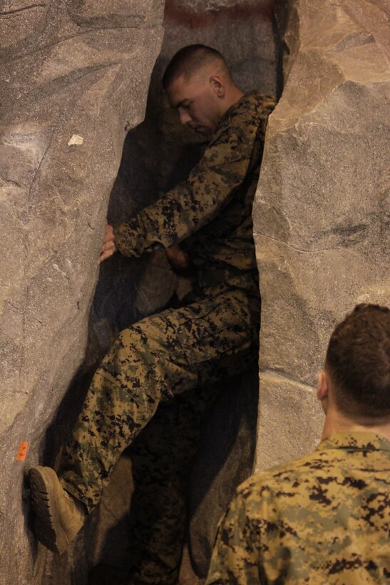 A Marine attempts to crack climb during the Assault Climbers Rehearsal Course May 18, 2011 at the Mountain Warfare Training Center Gym May 18, 2011. The course was a precursor to the official Assault Climbers course being conducted the following week.