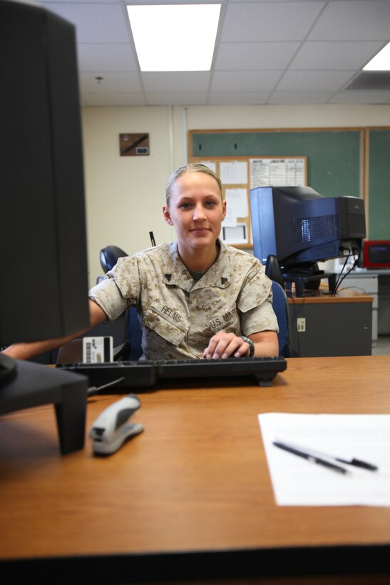 Cpl. Christinia L. Helms hard at work in the deployment section of Installation Personnel Administrative Center.