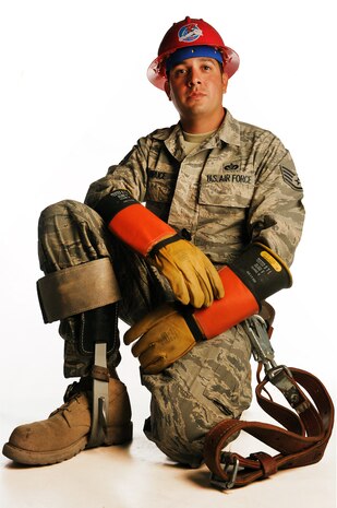 NELLIS AIR FORCE BASE, Nev.-- Staff Sgt. Kevin Bruce, 820th RED HORSE Squadron electrical system craftsman, displays the climbing gear used to perform his duties April 25. Prior to being assigned with the 820th RHS in 2010, Sgt. Bruce worked with base civil engineering. (U.S. Air Force illustrative photo by Senior Airman Stephanie Rubi) 