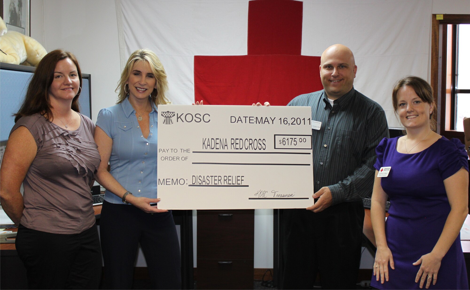 (From left to right) Kelly Samuelson, Kadena Officers’ Spouses Club president, and Cindy Wilsbach, KOSC honorary president, donate a check for $6,175 to the Kadena American Red Cross to aid Honshu (commonly referred to as mainland), Japan in relief efforts after the devastating March earthquake and following tsunami. Thanks to the efforts of 36 organizations and more than 54 individuals, in little more than two months, Team Kadena has donated more than $101,000 through the KARC to aid its host nation. (U.S. Air Force/ Courtesy photo)