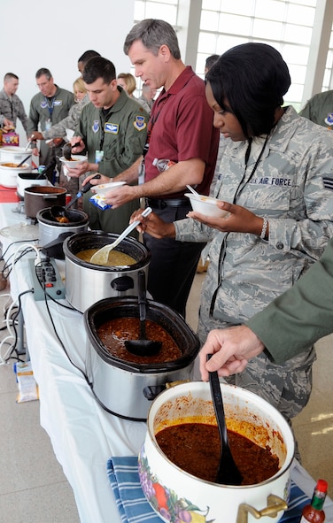 Barksdale Air Force Base personnel sample some chili during the Eighth Air Force Chilli Cookoff at the Cyber Innovation Center in Bossier City, La., May 18. The 8 AF has a chilli cookoff every quarter and awards a prize for first, second and third best-tasting chilli, which are voted on by each member. The winner for the best-tasting chilli this quarter was Staff Sgt. Thomas Anderson, 608th Strategic Operations Squadron. (U.S. Air Force photo/Staff Sgt. John Gordinier)(RELEASED)