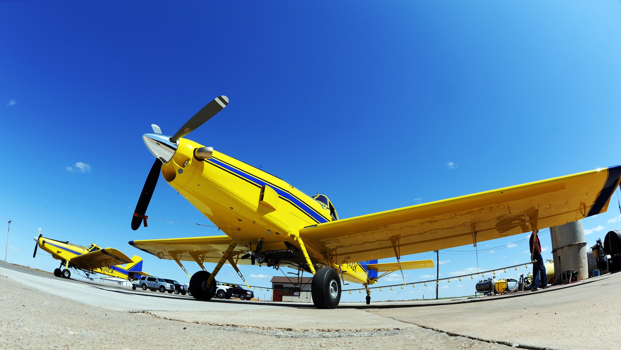 ALTUS AIR FORCE BASE, Okla. -- Two Air Tractor Model 502 aircraft parked at King Agricultural Aviation Incorporated in the City of Altus May 13. These spray planes will be seen more frequently in the local area starting at the end of May. Spectators are cautioned to keep their distance and remain upwind of the spray. (U.S. Air Force photo/ Airman 1st Class Kenneth W. Norman/ 97th Air Mobility Wing Public Affairs)