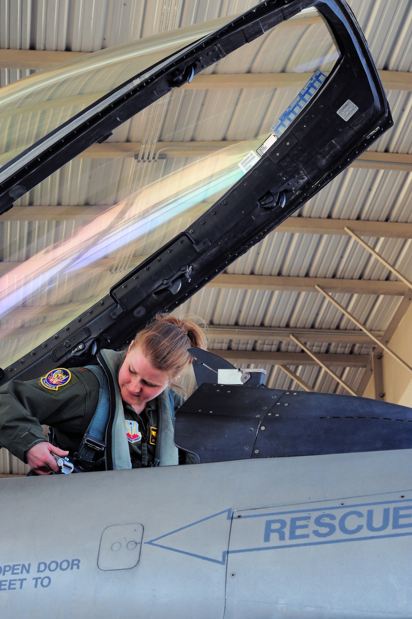Maj. Jaime Nordin, an F-16 Fighting Falcon pilot in the 79th Fighter Squadron at Shaw Air Force Base, S.C., straps in prior to a flight March 26, 2011. The Air Force has had women in fighter pilot roles since 1993. (U.S. Air Force photo/ Airman 1st Class Daniel Phelps)