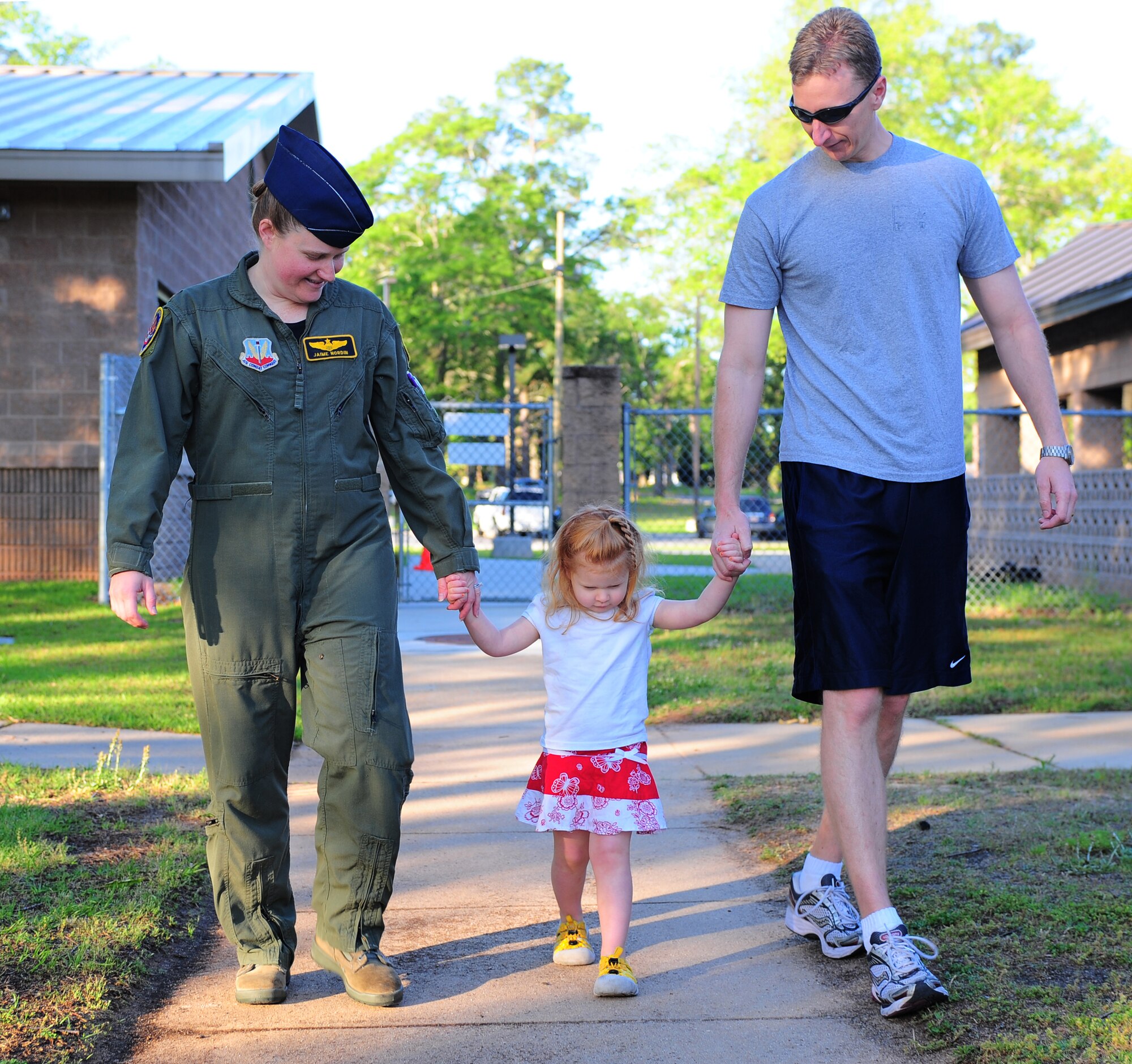 Maj. Jaime Nordin, an F-16 Fighting Falcon pilot in the 79th Fighter Squadron at Shaw Air Force Base, S.C., and her husband, Maj. Cameron Nordin, the 20th Fighter Wing plans and inspections officer, drop off their daughter Caleigh at the base’s child development center April 28, 2011. The Air Force has had women in fighter pilot roles since 1993. (U.S. Air Force photo/Airman 1st Class Daniel Phelps)