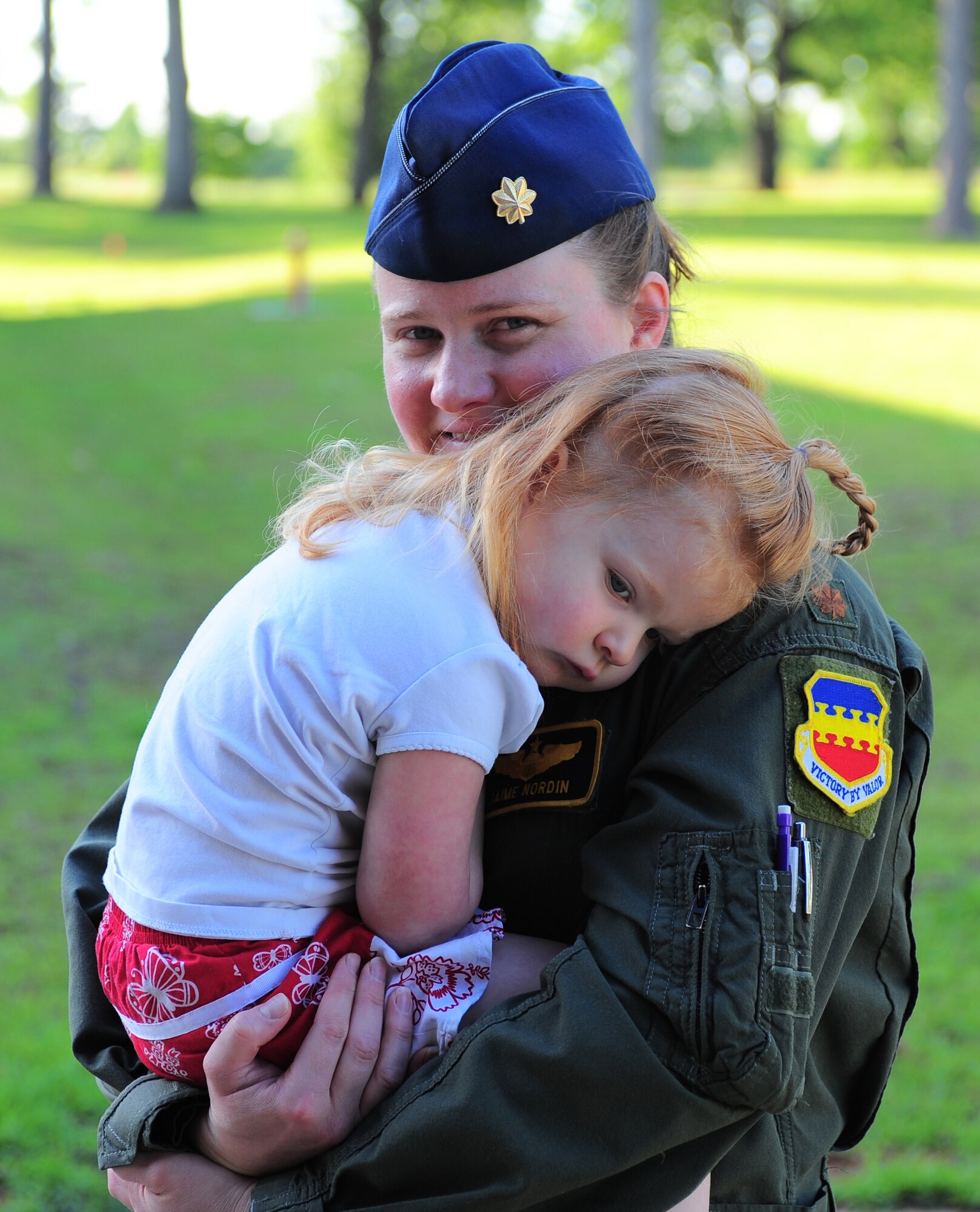 Maj. Jaime Nordin, an F-16 Fighting Falcon pilot in the 79th Fighter Squadron at Shaw Air Force Base, S.C., drops off her daughter Caleigh at the base’s child development center April 28, 2011. The Air Force has had women in fighter pilot roles since 1993. (U.S. Air Force photo/Airman 1st Class Daniel Phelps)